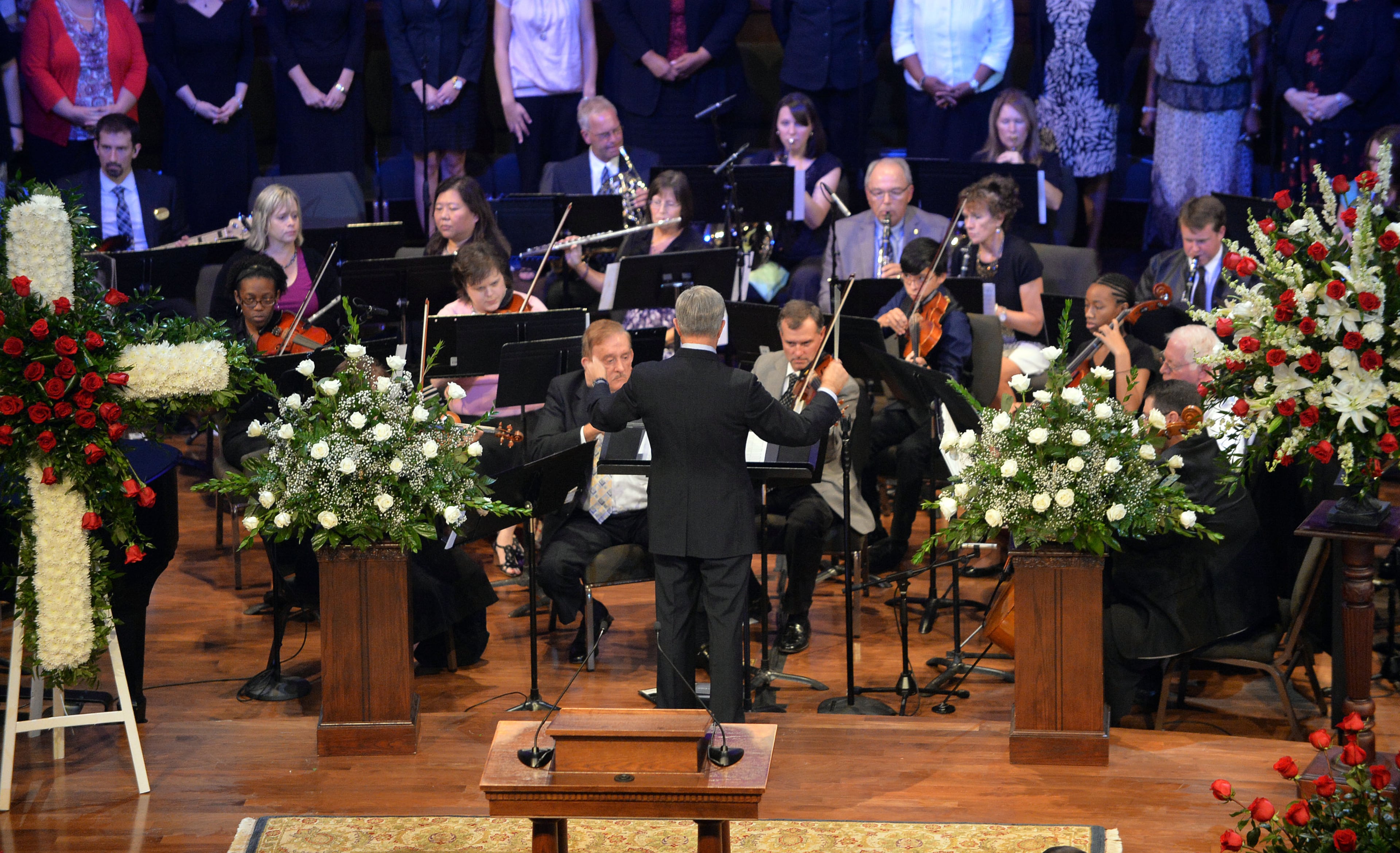 An orchestra, led by Tom Lynn, plays a prelude during at the funeral service for Chick-fil-A founder Truett Cathy at the First Baptist Church, Jonesboro, Wednesday Sept. 10, 2014.