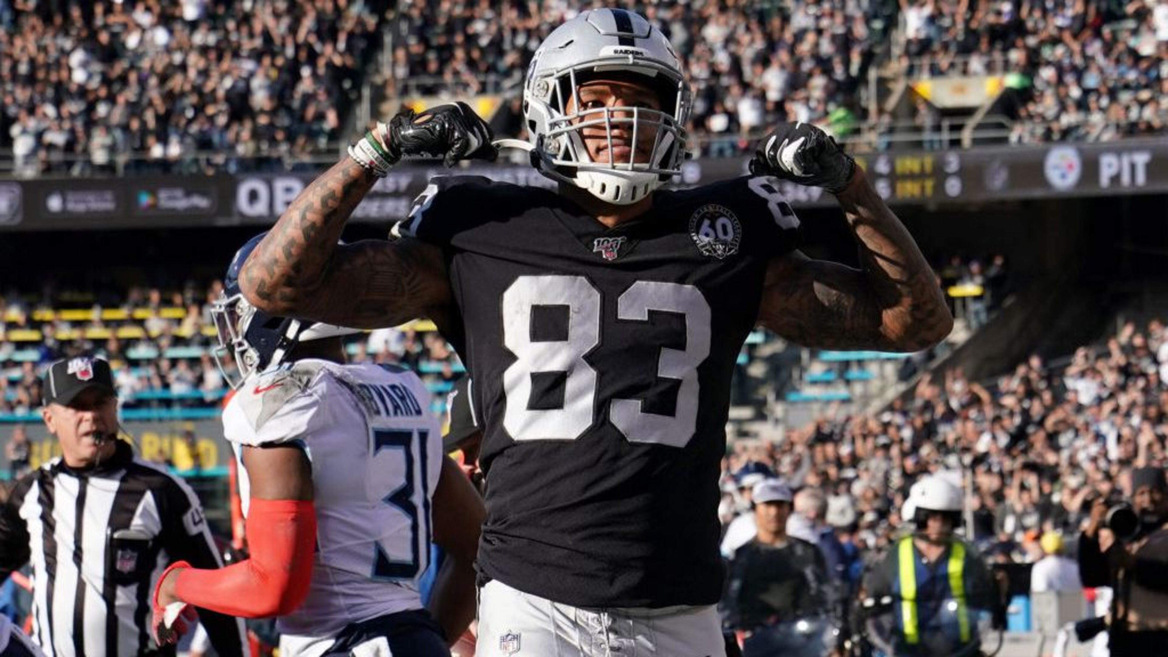 OAKLAND, CALIFORNIA - DECEMBER 08: Darren Waller #83 of the Oakland Raiders reacts after catching a pass and taking it to the two-yard line against the Tennessee Titans during the first half of an NFL football game at RingCentral Coliseum on December 08, 2019 in Oakland, California. (Photo by Thearon W. Henderson/Getty Images)