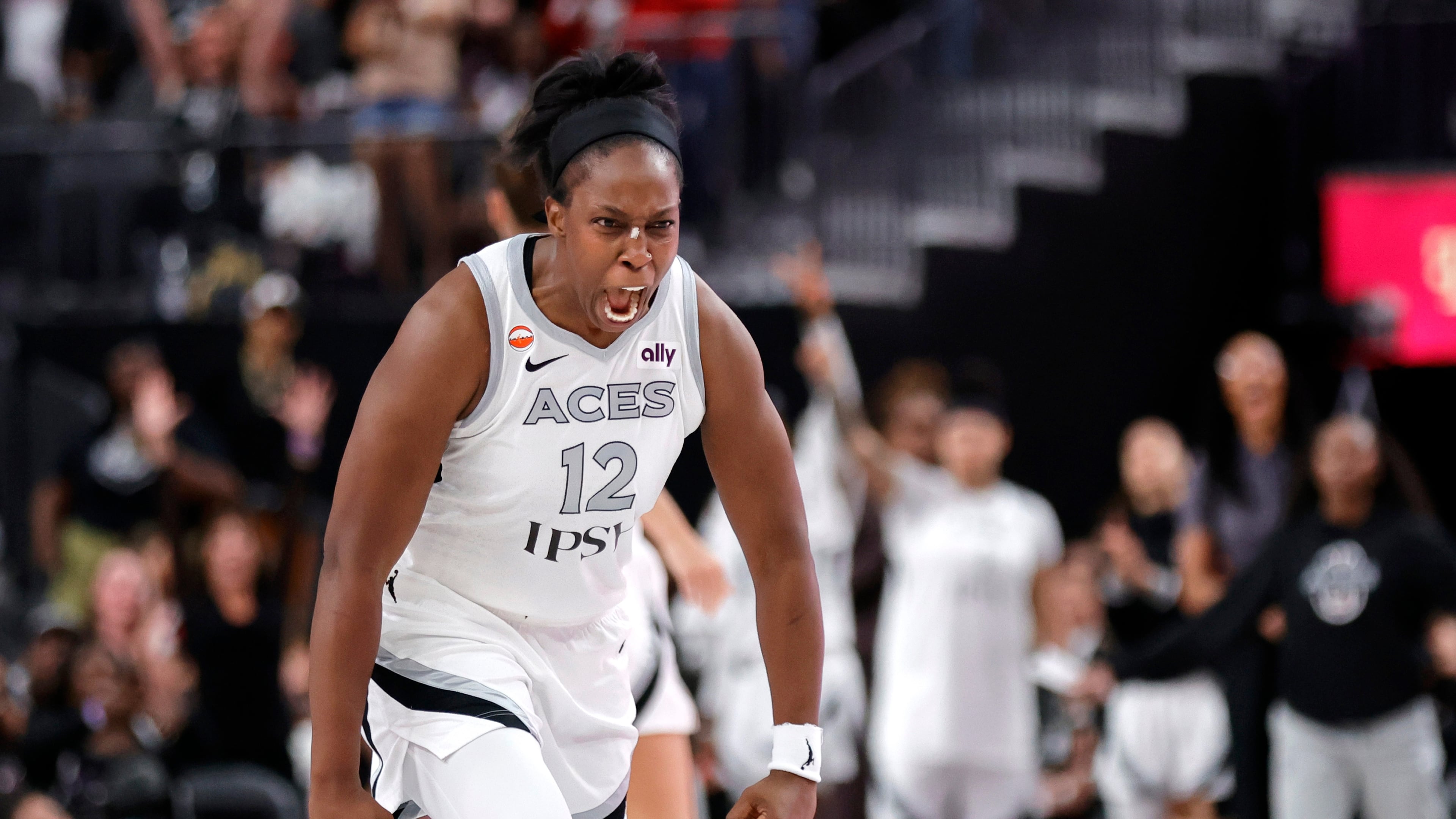 Las Vegas Aces guard Chelsea Gray (12) reacts after making a basket to send the game into overtime during the second half of an WNBA basketball game against the Chicago Sky Friday, July 3, 2026, in Las Vegas. (Steve Marcus/Las Vegas Sun via AP)