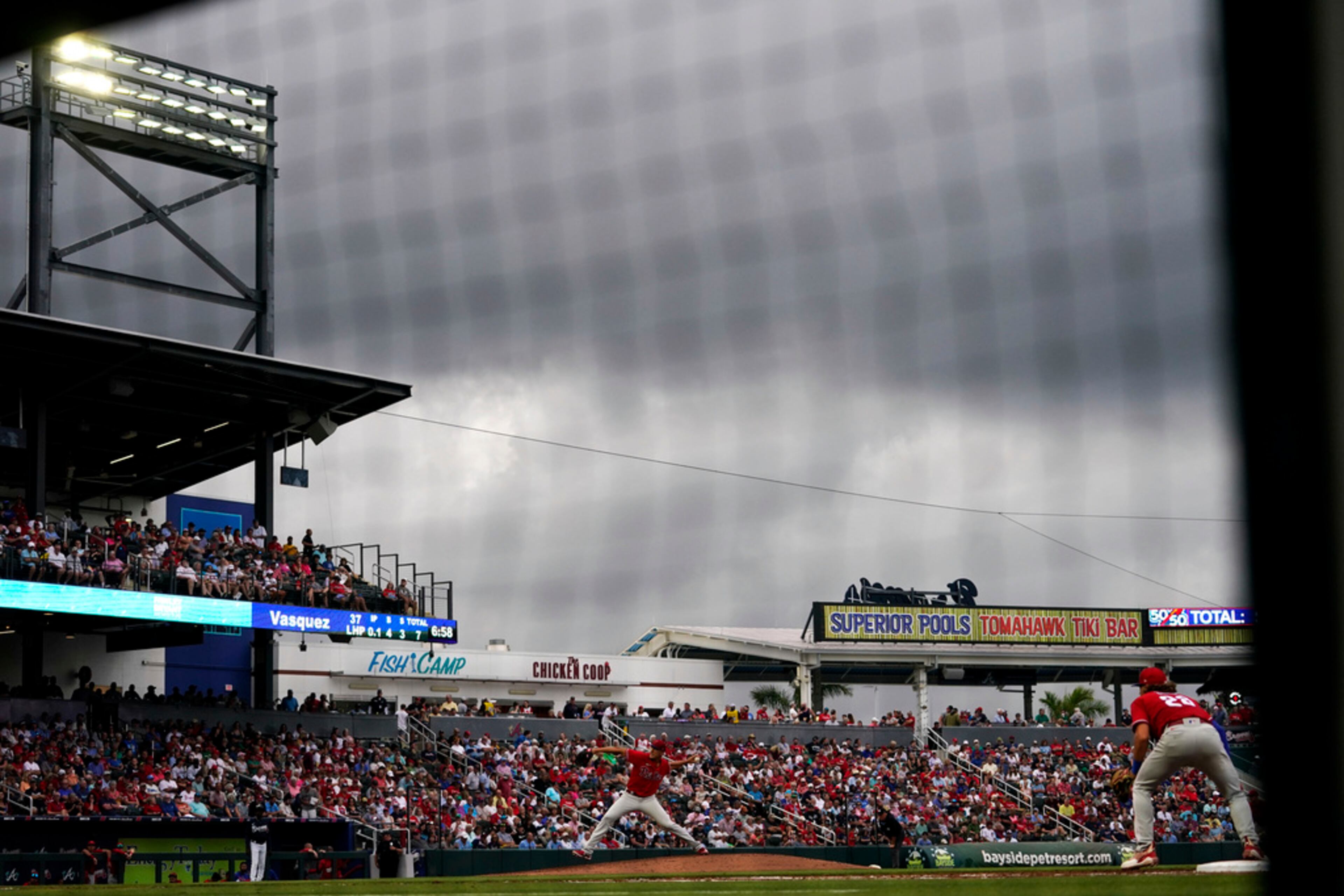 Philadelphia Phillies pitcher Andrew Vasquez throws in the fourth inning of a spring training baseball game against the Atlanta Braves in North Port, Fla., Saturday, March 18, 2023. (AP Photo/Gerald Herbert)