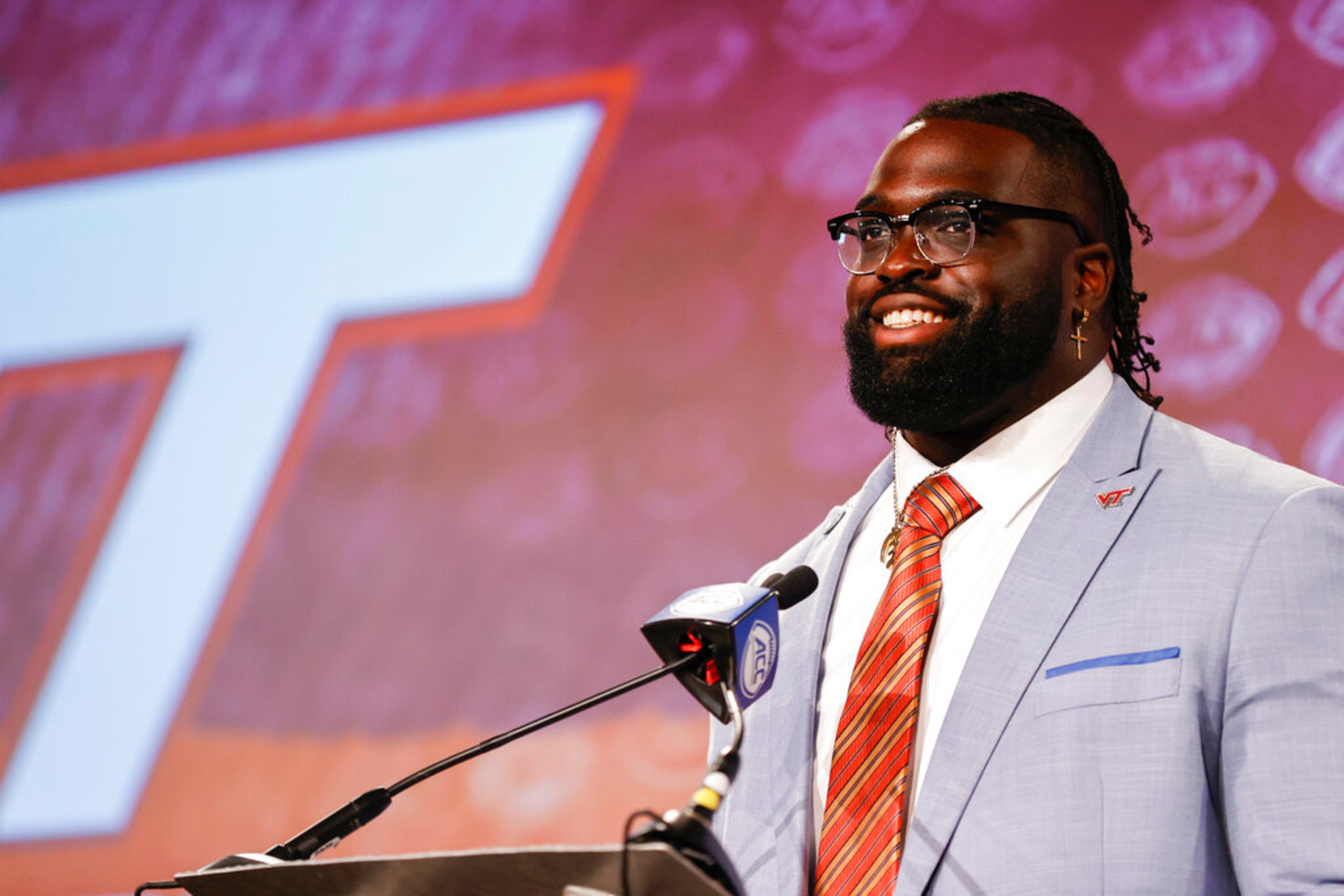 Virginia Tech offensive lineman Silas Dzansi answers a question at the NCAA college football Atlantic Coast Conference Media Days in Charlotte, N.C., Thursday, July 21, 2022. (AP Photo/Nell Redmond)