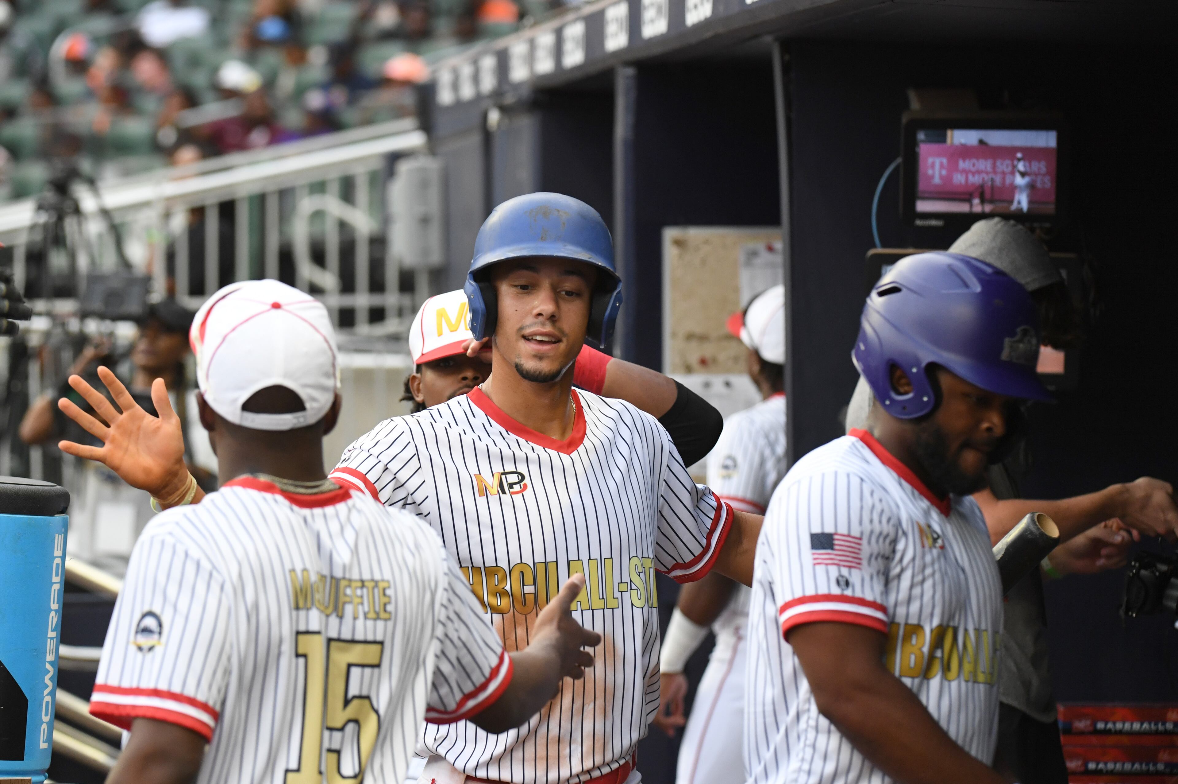 June 3, 2022 Atlanta - HBCU All-Star Navy team's outfielder Tim Dixon (17) celebrates after scoring on an RBI double hit by HBCU All-Star White team's Cameron Bufford in the first inning of the Minority Baseball Prospects HBCU All-Star Game at Truist Park on Friday, June 3, 2022. (Hyosub Shin / Hyosub.Shin@ajc.com)