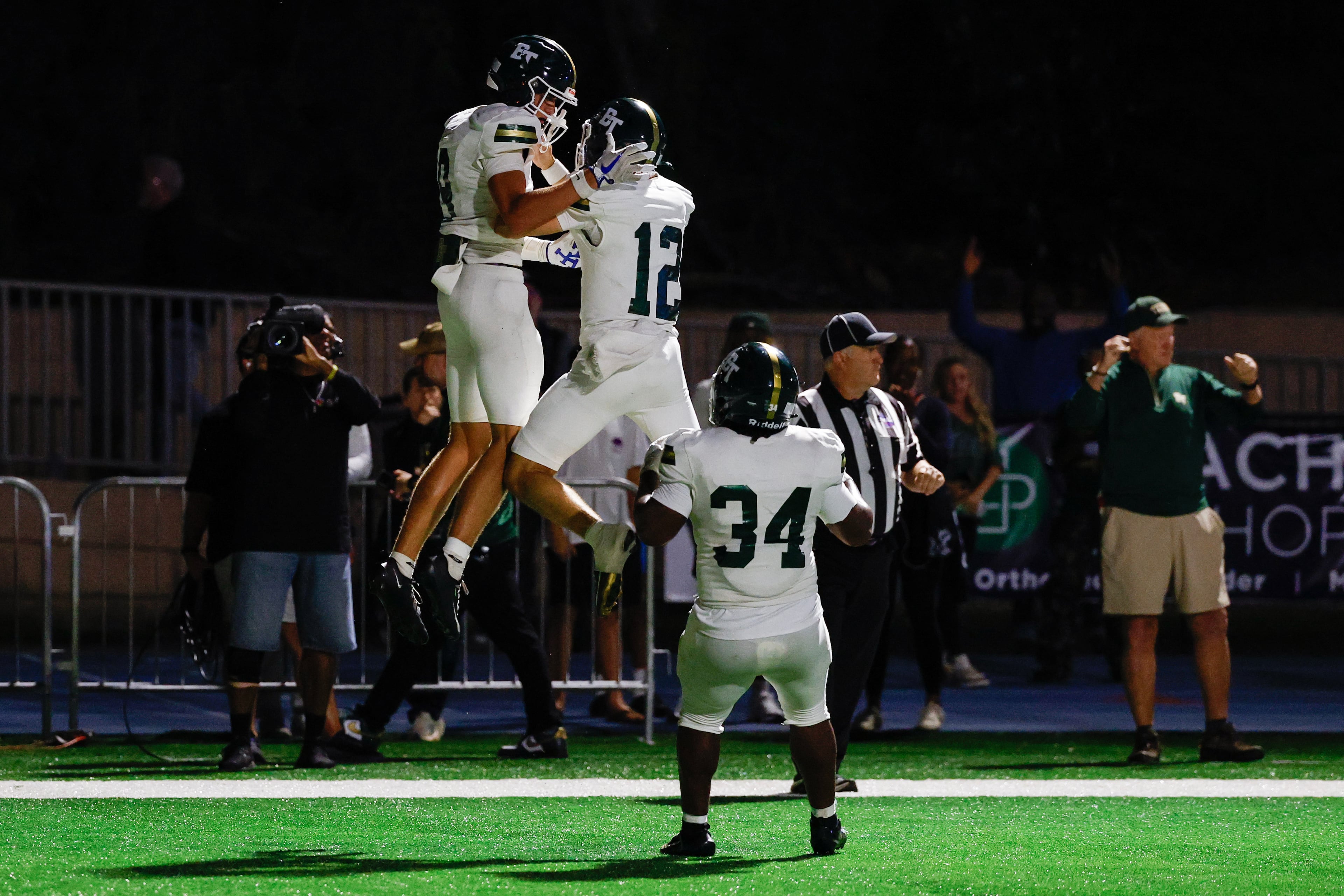 Blessed Trinity wide receiver Quinn Smith (from left) celebrates his touchdown reception against Marist with quarterback Luke Ray and running back MJ Craft on Friday, Sept. 25, 2026, in Atlanta. (Erik S. Lesser for the AJC)