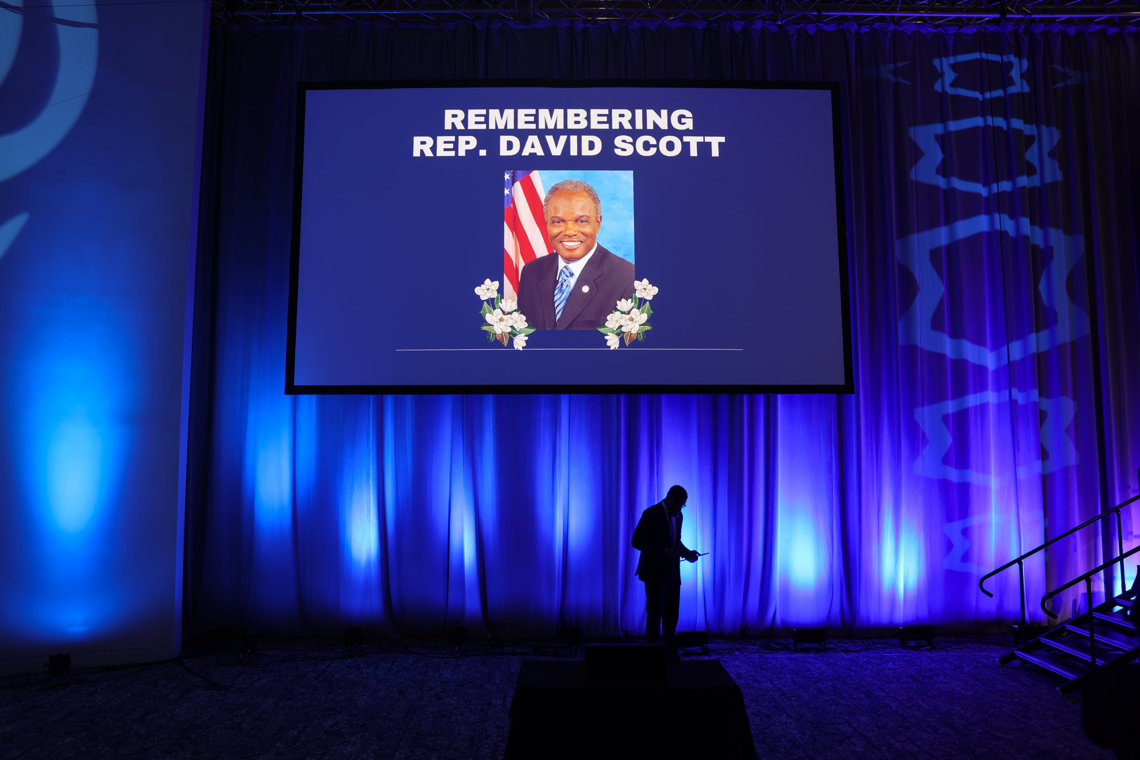 A moment of silence is held for the late Rep. David Scott at the Democratic Party of Georgia state convention at Savannah Convention Center in Savannah on Aug. 1, 2026. (Arvin Temkar/AJC)