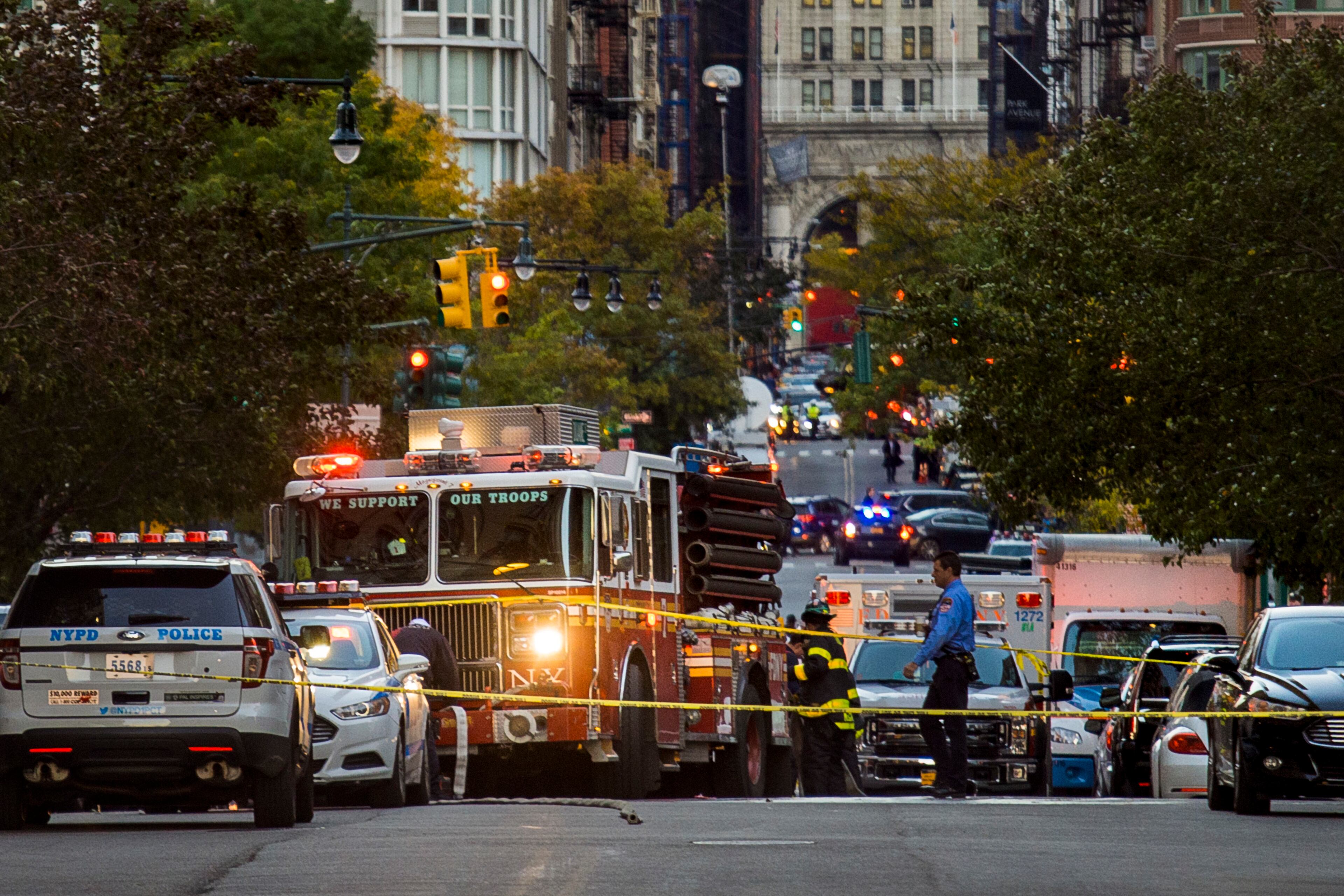 Firemen work in the scene after a motorist drove onto a busy bicycle path near the World Trade Center memorial and struck several people Tuesday, Oct. 31, 2017, in New York. (AP Photo/Andres Kudacki)