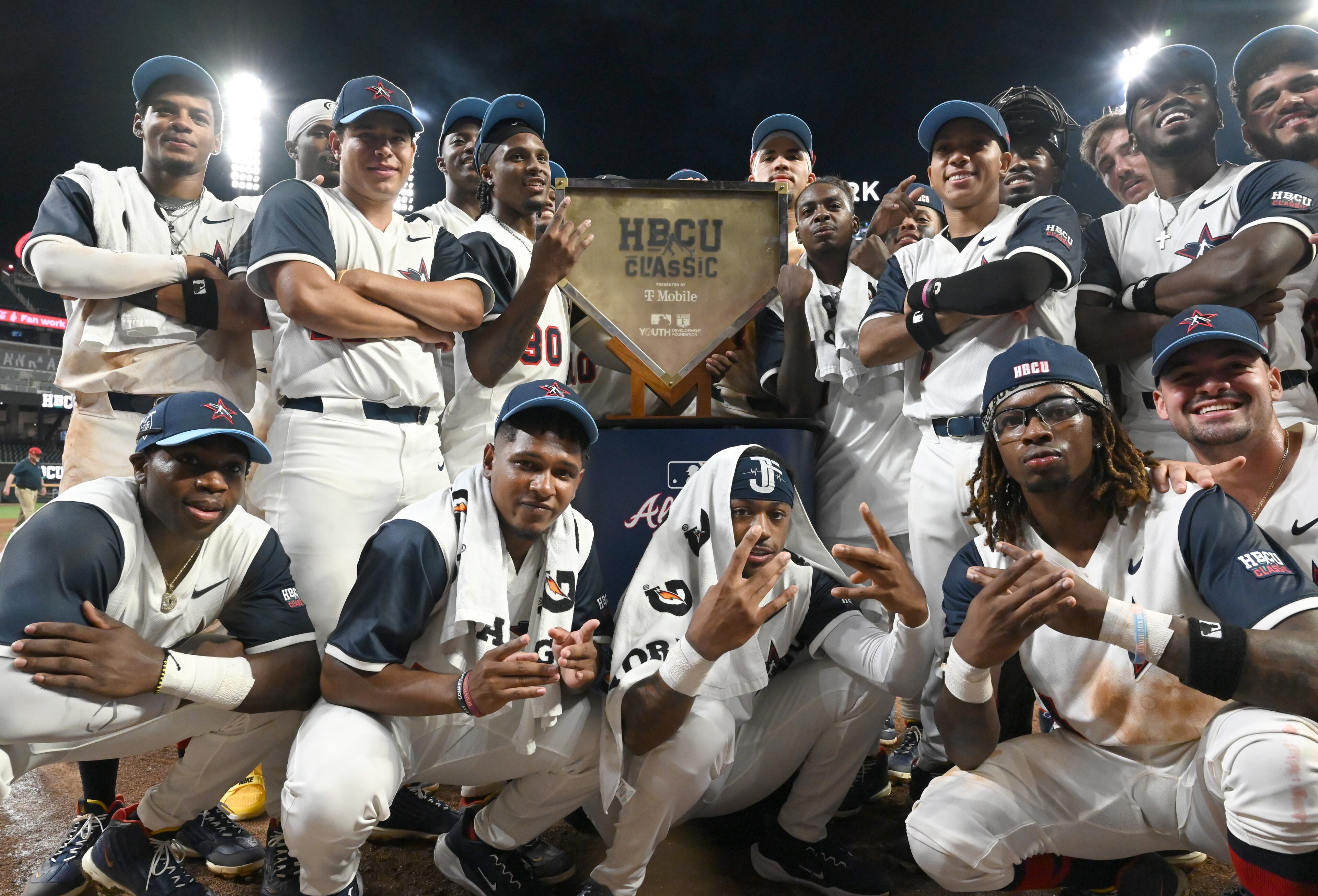 National League players celebrate their 7-4 victory over the American League during the HBCU Swingman Classic at Truist Park on Tuesday, July 11, 2025, in Atlanta. (Hyosub Shin/AJC)