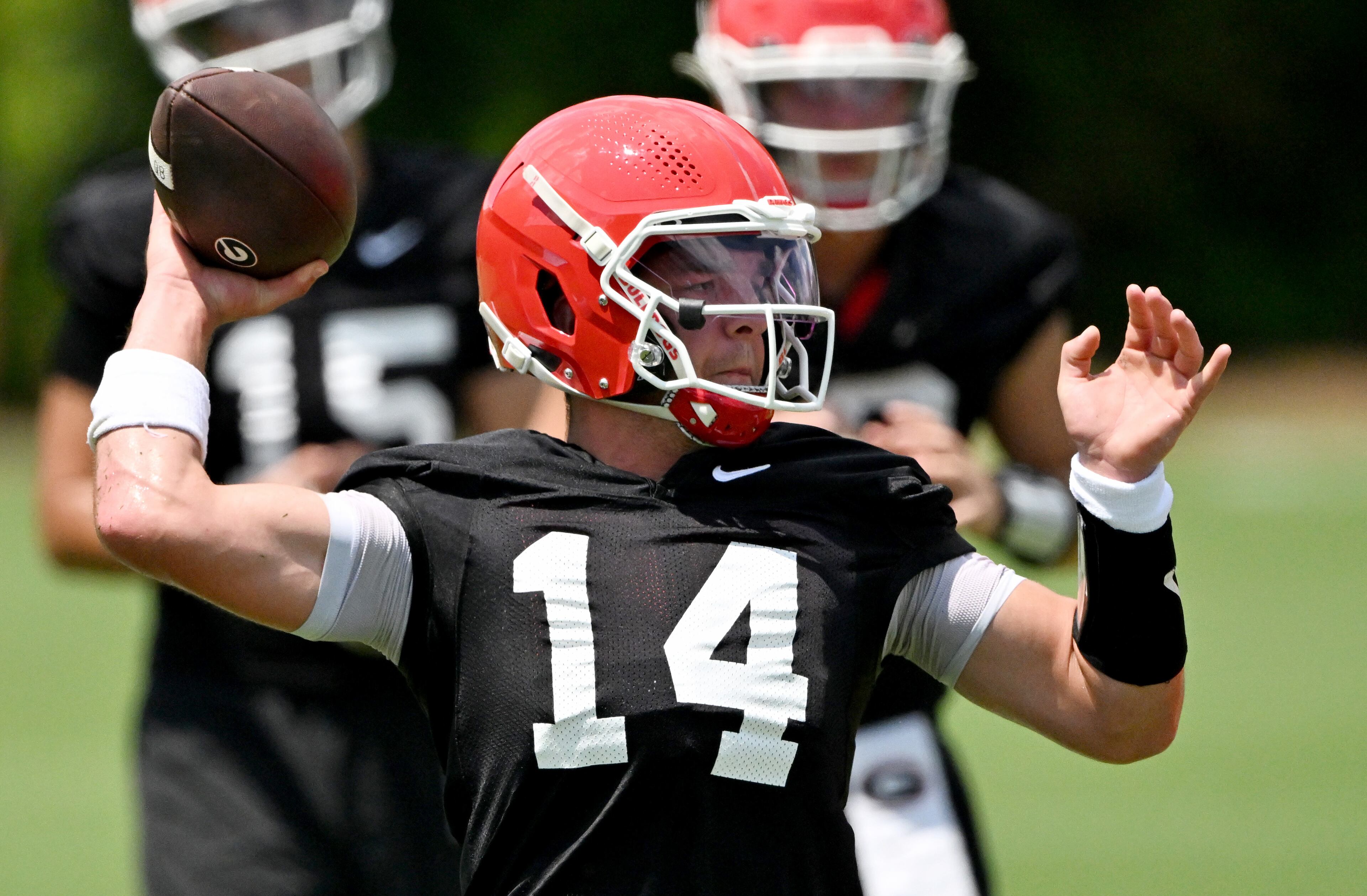 Georgia quarterback Gunner Stockton (14) runs a drill during a football practice at the University of Georgia practice facility, Thursday, July 31, 2025, in Athens. (Hyosub Shin / AJC)