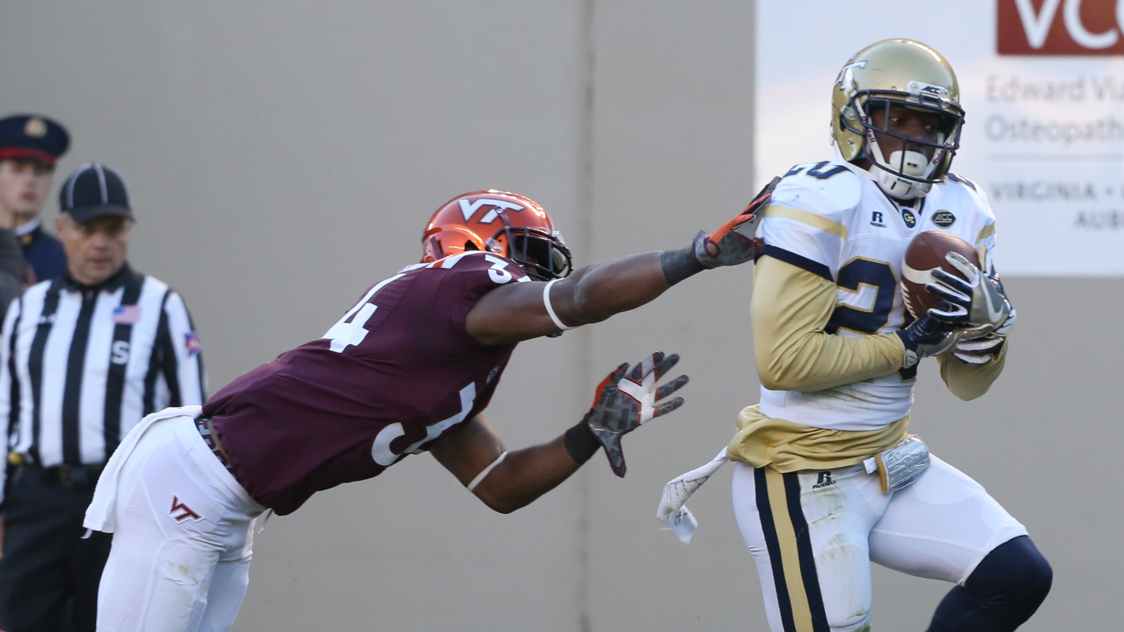 Georgia Tech safety Lawrence Austin (20) intercepts a pass in the endzone in front of Virginia Tech receiver Travon McMillian (34) during the first half of an NCAA football game in Blacksburg, Va., Saturday, Nov. 12 2016. (Matt Gentry/The Roanoke Times via AP)