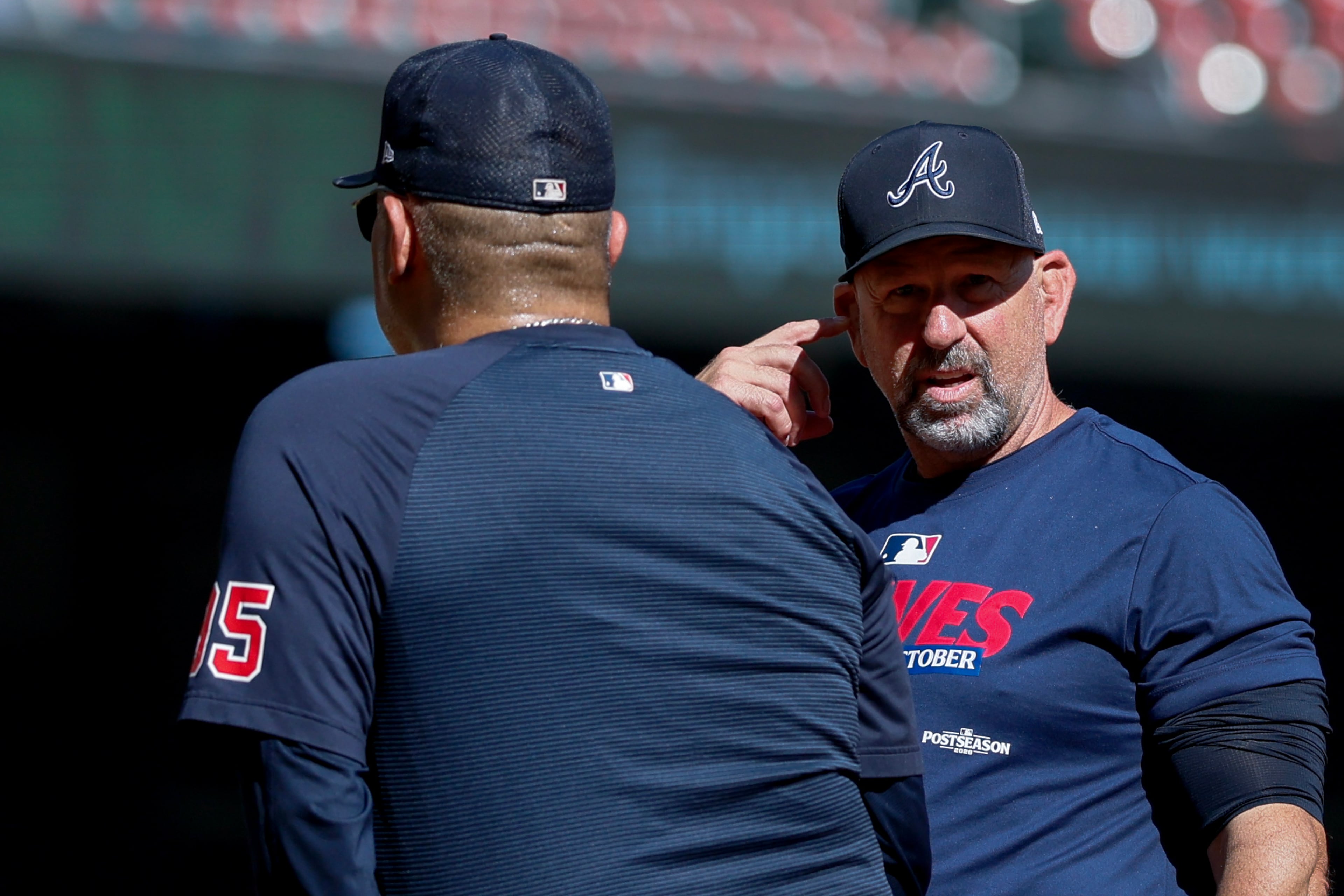 Atlanta Braves manager Walt Weiss, right, speaks with coach Eddie Pérez (95) during batting practice before Game 4 of the MLB National League Division Series between the Atlanta Braves and the Los Angeles Dodgers, Wednesday, Oct. 7, 2026, in Atlanta. (Miguel Martinez/AJC)