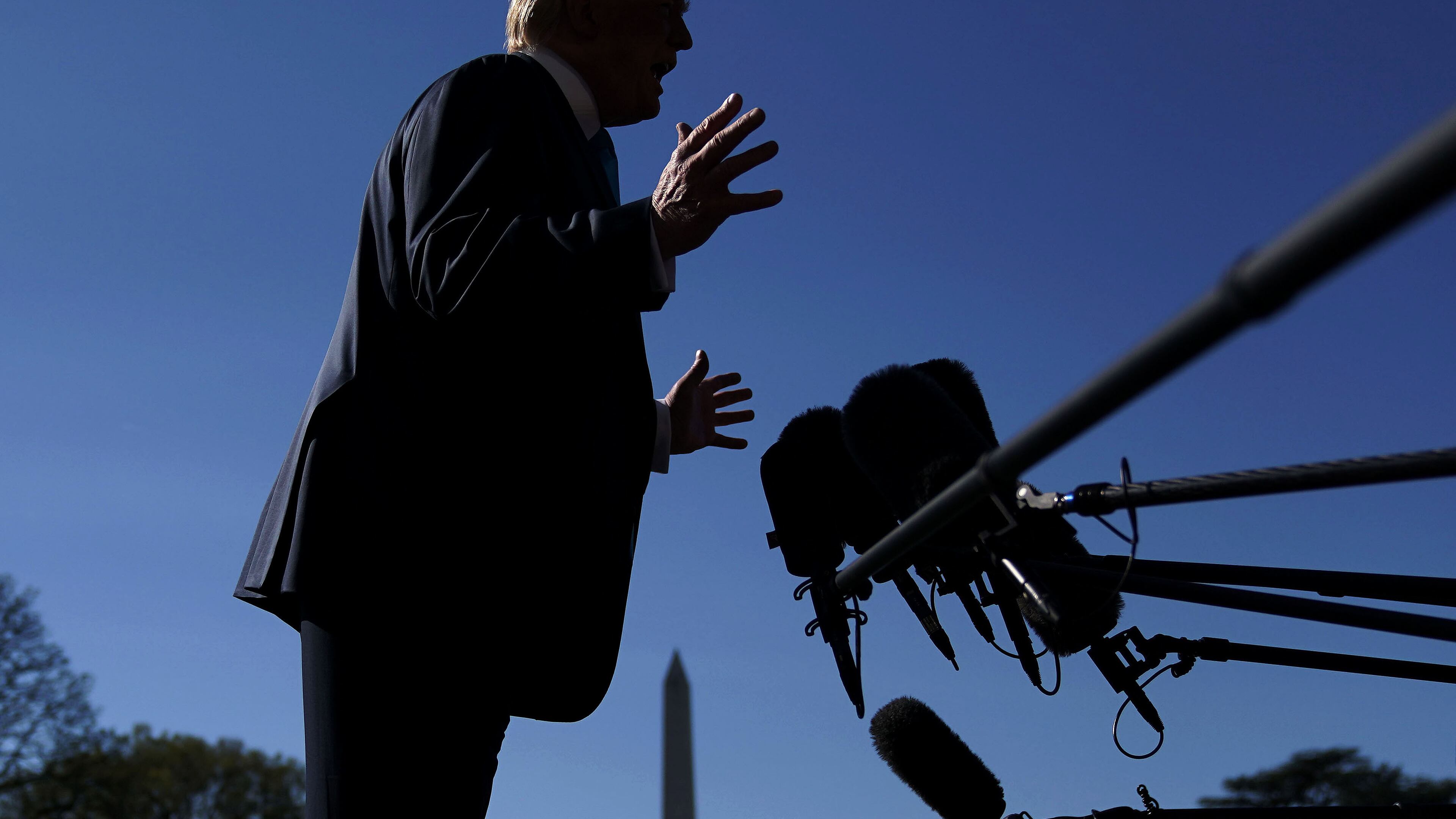 President Donald Trump speaks to the press prior leaving for Texas on Wednesday. Alex Wong/Getty Images