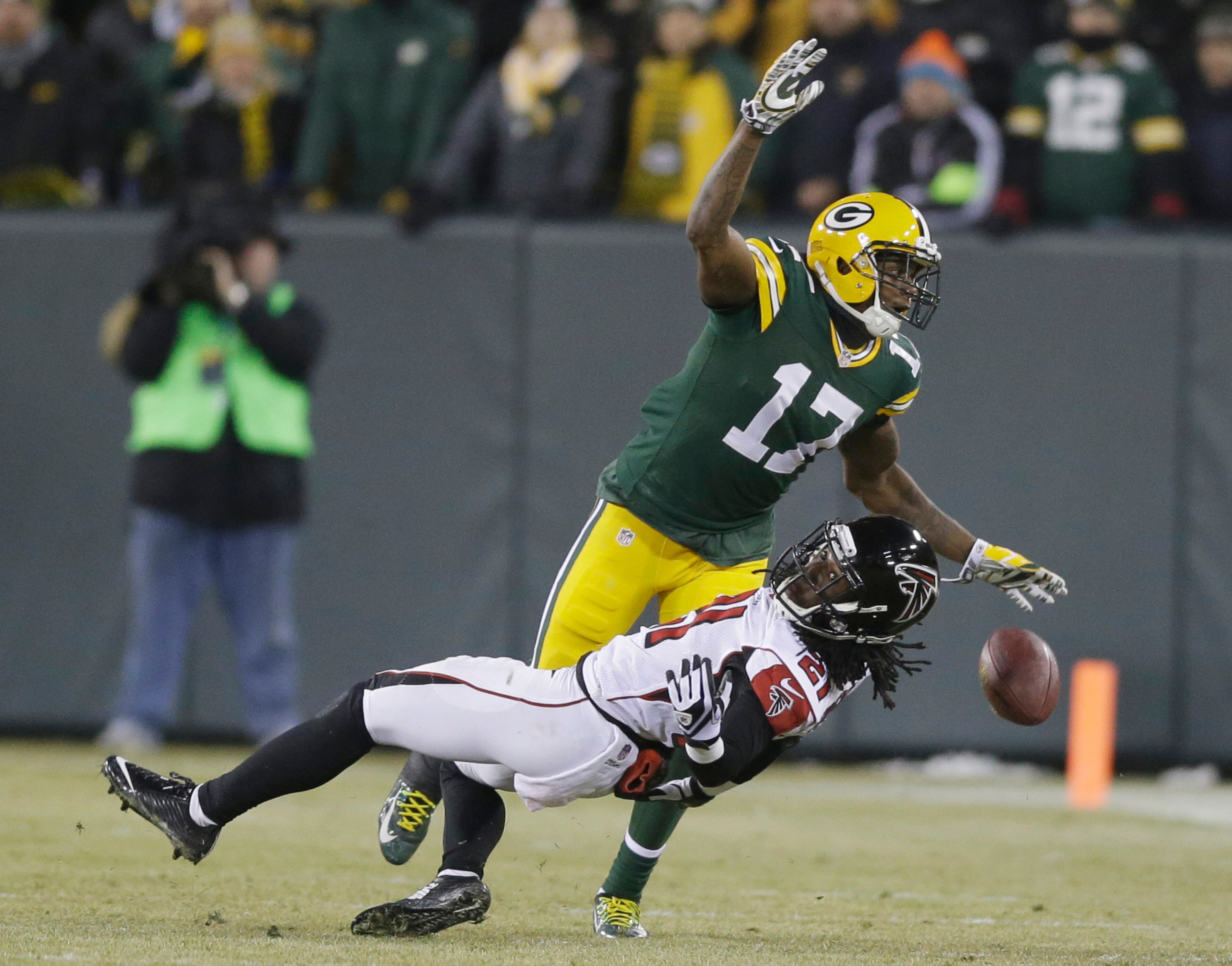 Atlanta Falcons' Desmond Trufant (21) breaks up a pass intended for Green Bay Packers' Davante Adams (17) during the second half Monday, Dec. 8, 2014, in Green Bay, Wis.