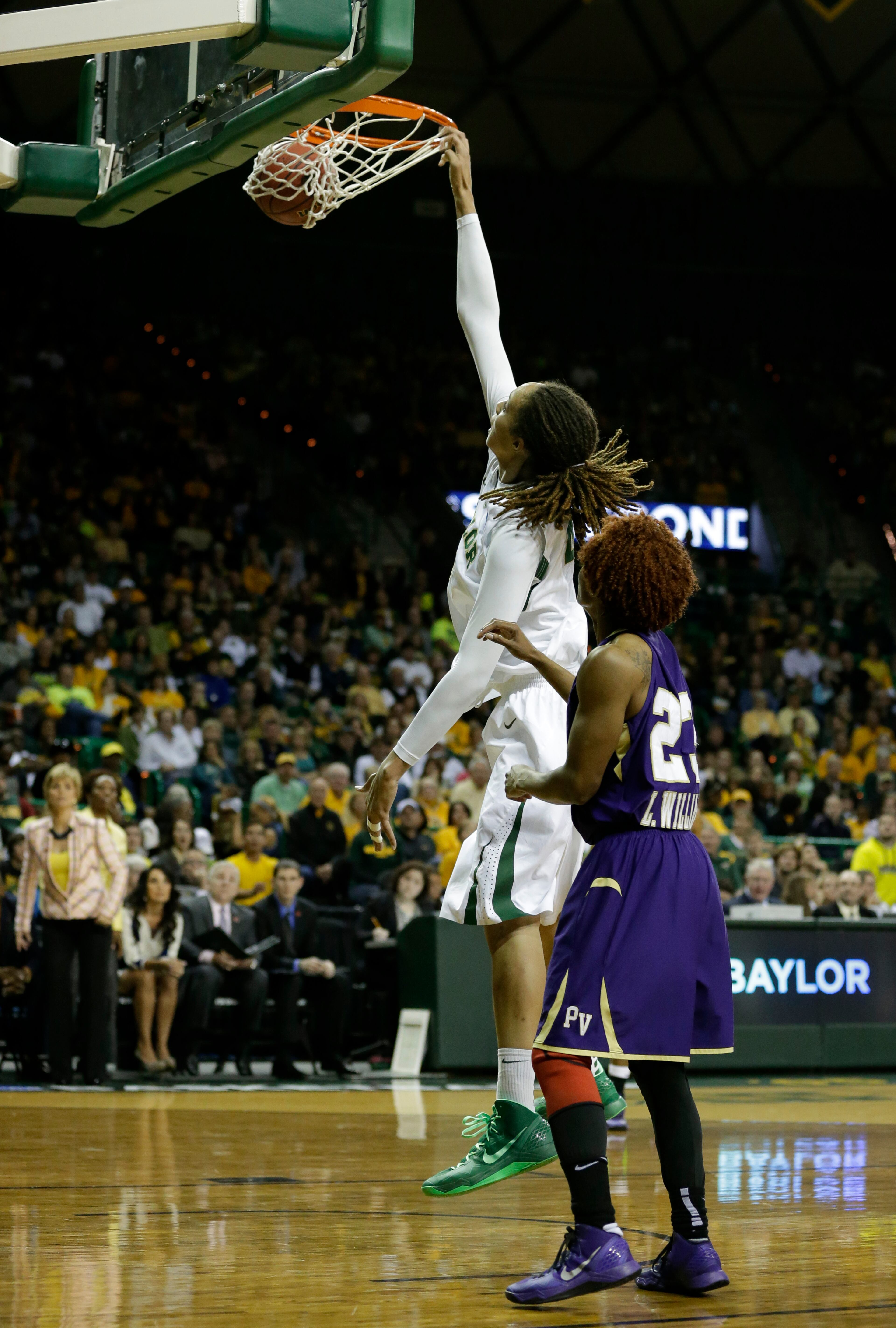 Baylor center Brittney Griner (42) dunks as Prairie View A&M guard Latia Williams (23) watches during a first-round game in the women's NCAA college basketball tournament Sunday March 24, 2013, in Waco, Texas. Baylor won 82-40. (AP Photo/Tony Gutierrez)