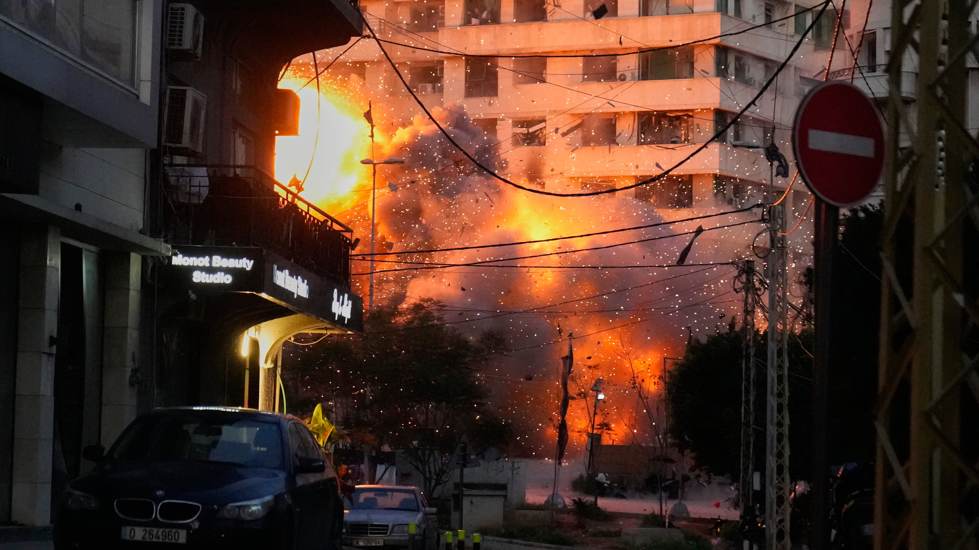 An explosion erupts from a building following an Israeli strike in central Beirut, Lebanon, Wednesday, March 18, 2026. (AP Photo/Hussein Malla)