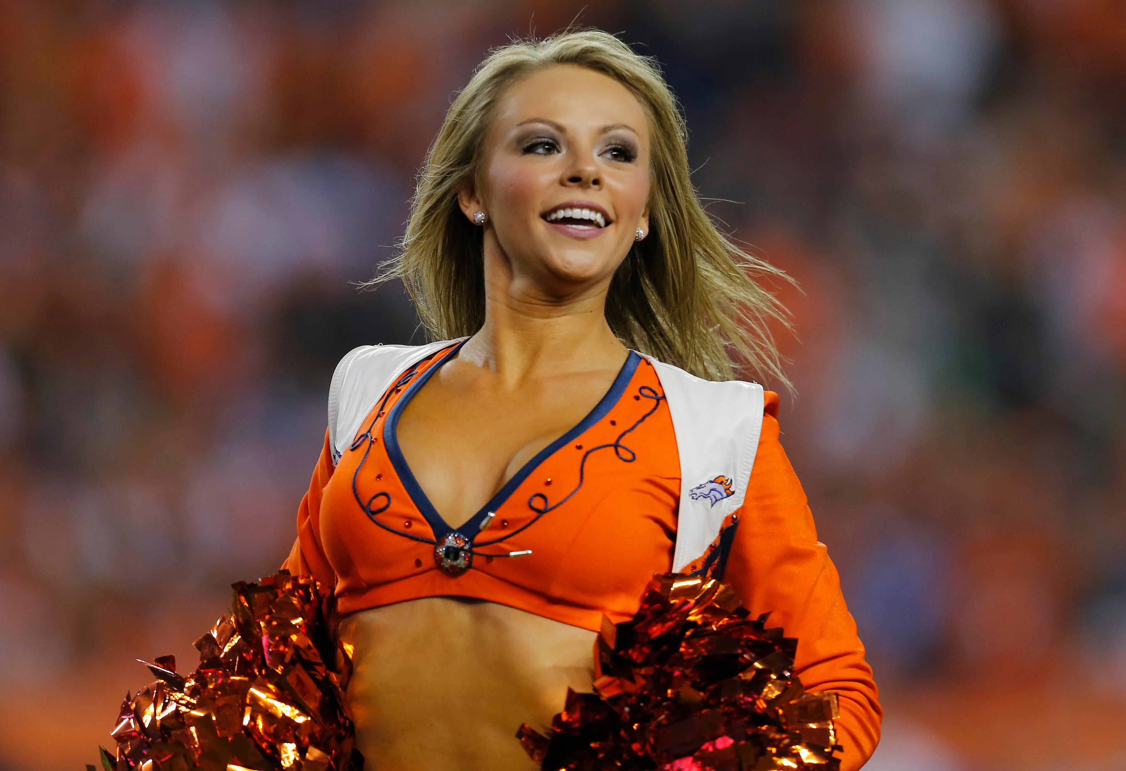 A Denver Broncos cheerleader performs during the first half of an NFL football game against the Indianapolis Colts, Sunday, Sept. 7, 2014, in Denver. (AP Photo/Joe Mahoney)