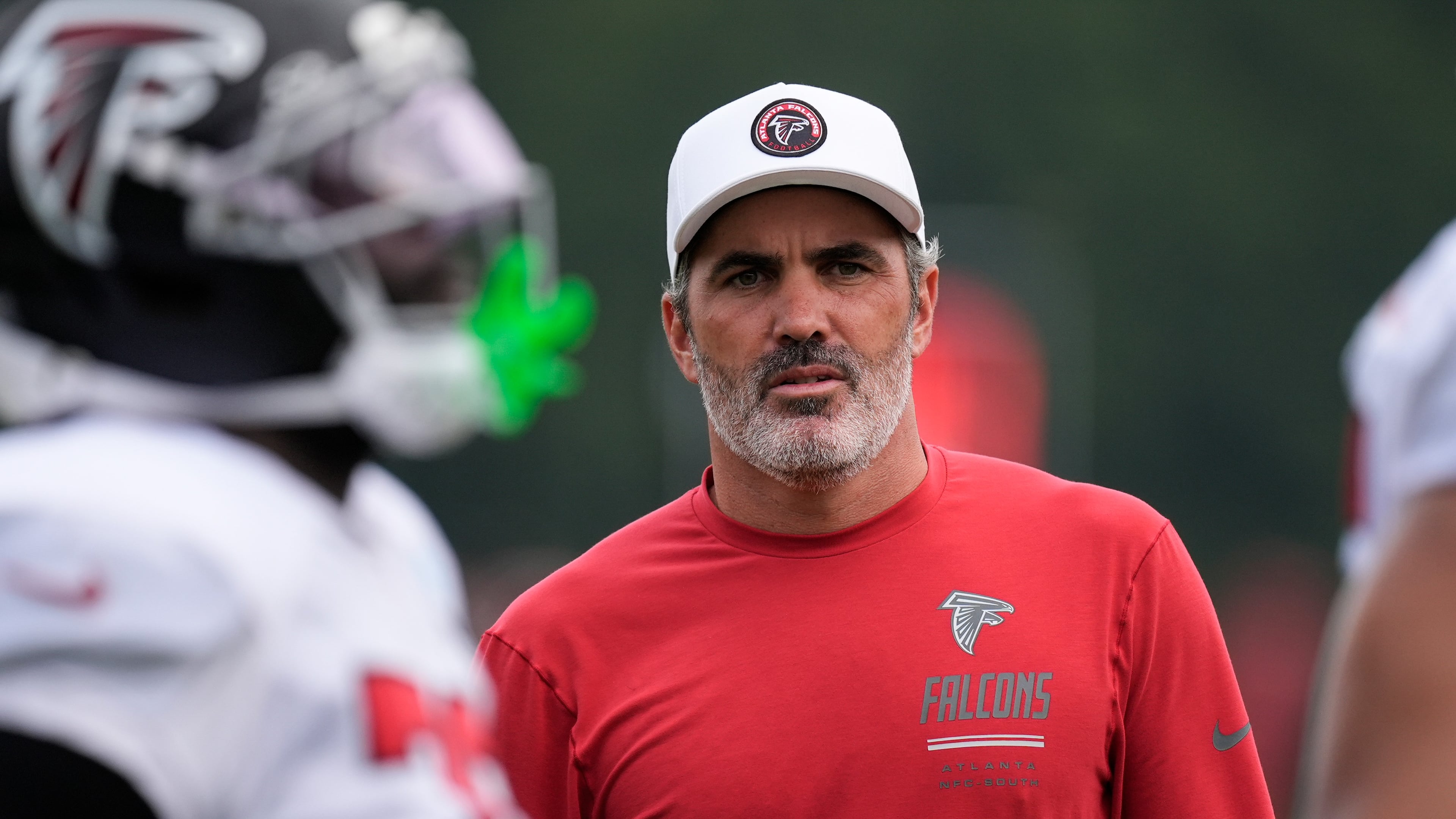 Atlanta Falcons head coach Kevin Stefanski watches the team work out during an NFL training camp, Friday, Aug. 7, 2026, in Flowery Branch, Ga. (AP Photo/Mike Stewart)