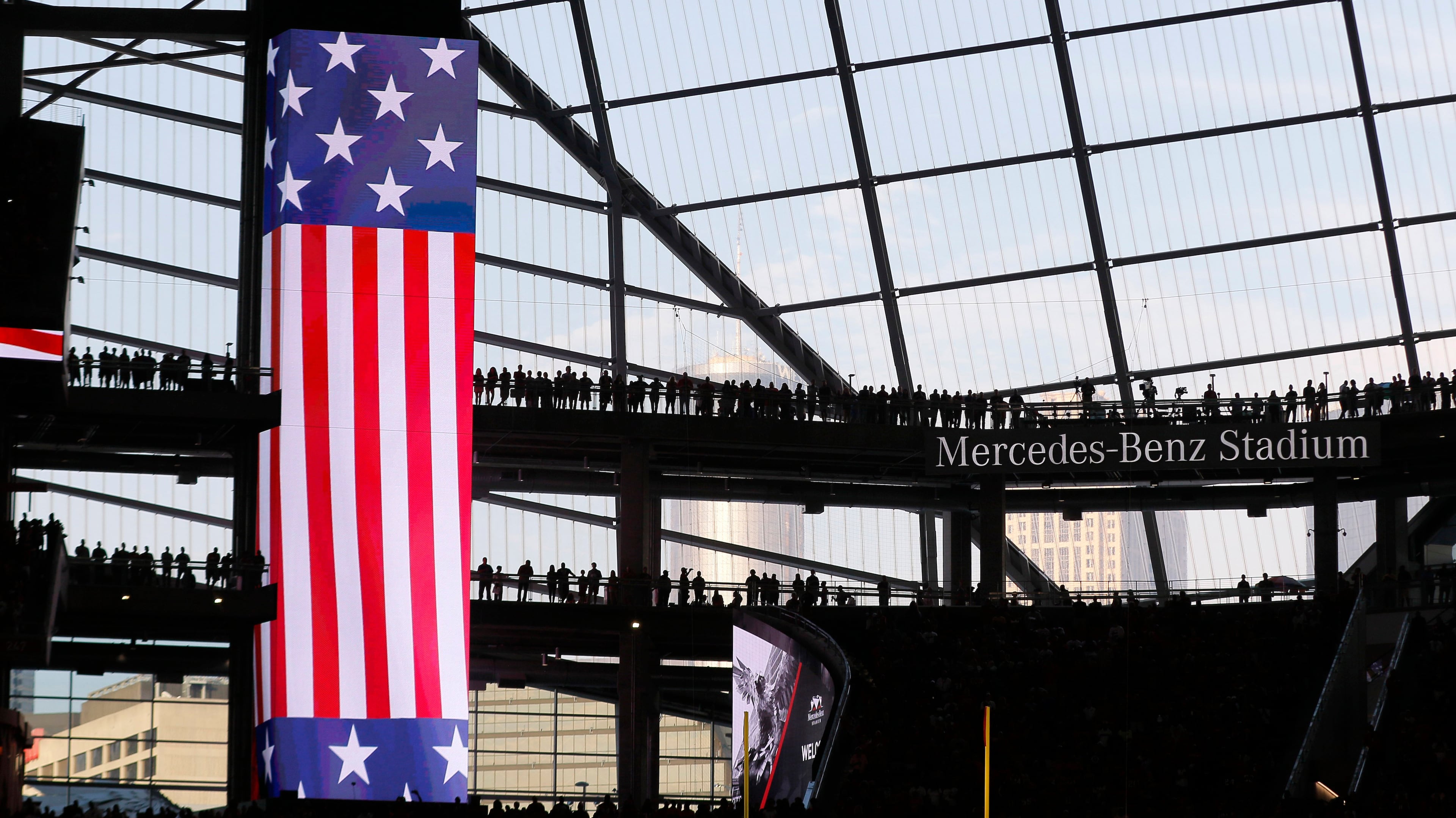 Fans stand for the national anthem before the start of the first game at Mercedes-Benz Stadium Saturday, Aug., 26, 2017 -- and exhibition game against the Arizona Cardinals in Atlanta.