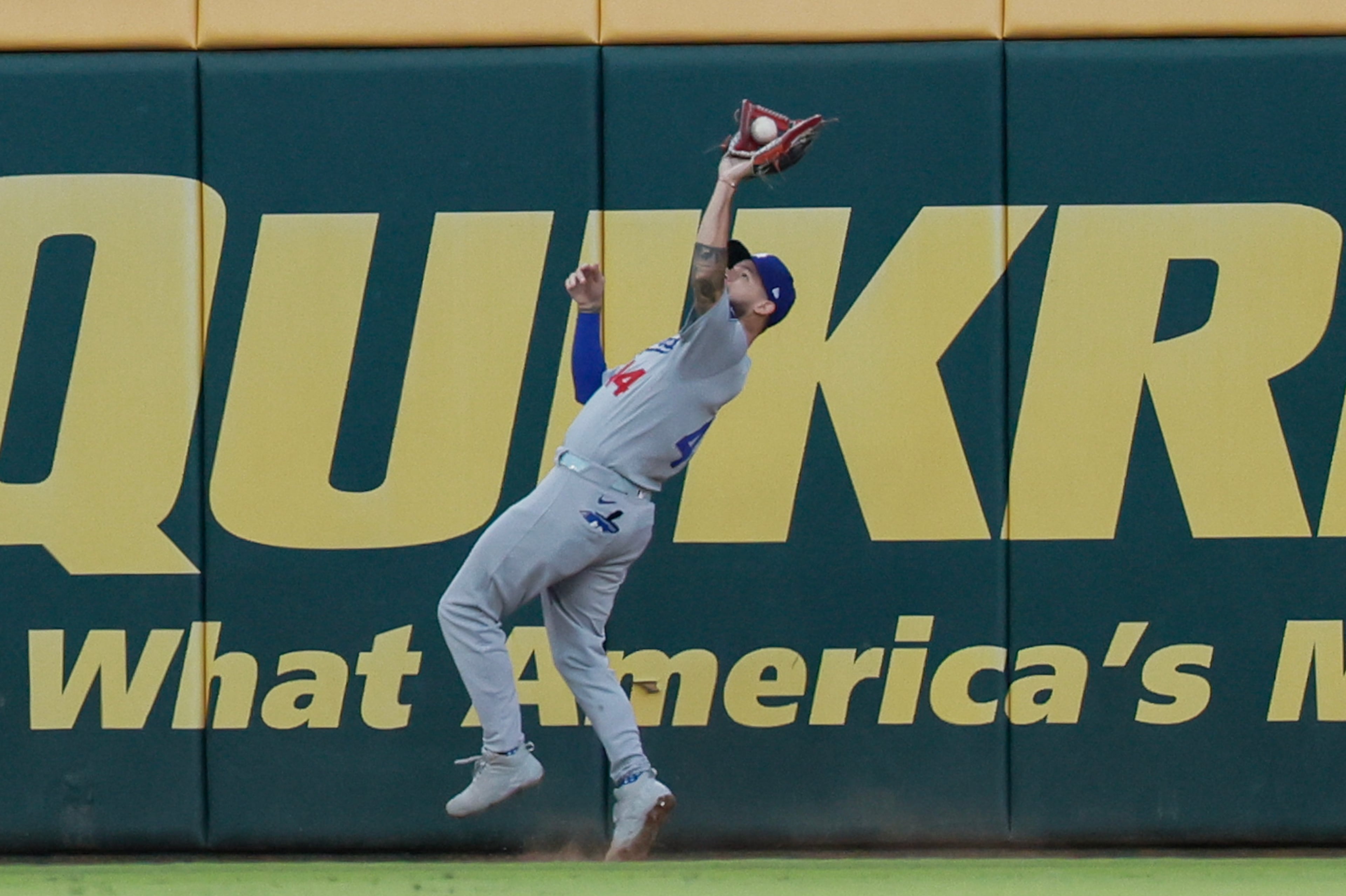 Los Angeles Dodgers center fielder Andy Pages (44) catches a deep fly ball hit by Atlanta Braves' Matt Olson during the third inning of Game 4 of the MLB National League Division Series between the Atlanta Braves and the Los Angeles Dodgers, Wednesday, Oct. 7, 2026, in Atlanta. (Miguel Martinez/AJC)