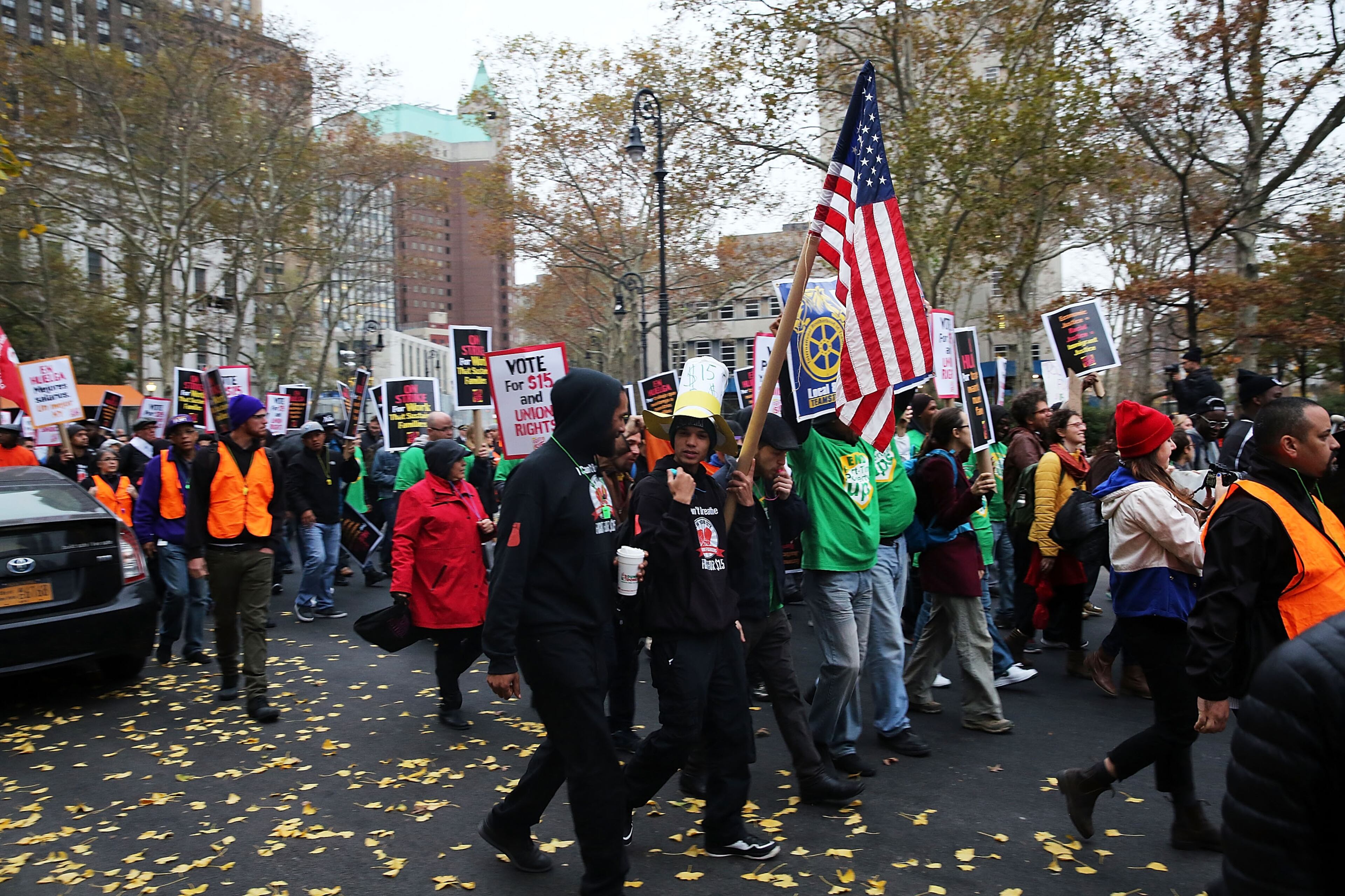 NEW YORK, NY - NOVEMBER 10: Low wage workers and supporters protest for a $15 an hour minimum wage on November 10, 2015 in New York, United States. In what organizers are calling a National Day of Action for $15 and hour minimum wage, thousands of people took to the streets across the country to stage protests in front of businesses that are paying some of their workers the minimum wage. Home care workers, employees in retail and fast food restaurants say that the current minimum is not a living wage. (Photo by Spencer Platt/Getty Images)