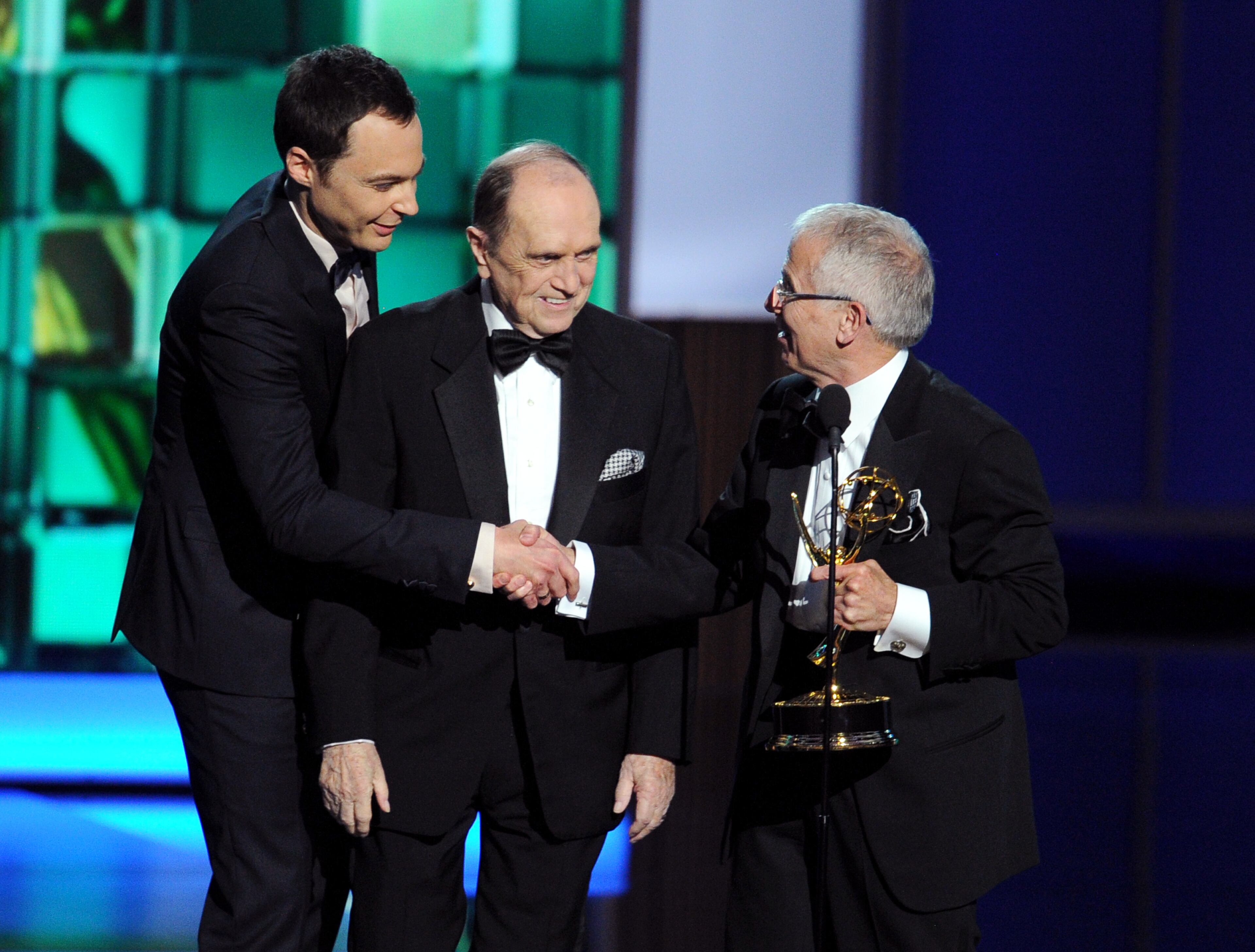 LOS ANGELES, CA - SEPTEMBER 22: Actors Jim Parsons and Bob Newhart present the award to the Winner for Best Directing for a Variety Series, Don Roy King onstage during the 65th Annual Primetime Emmy Awards held at Nokia Theatre L.A. Live on September 22, 2013 in Los Angeles, California. (Photo by Kevin Winter/Getty Images)