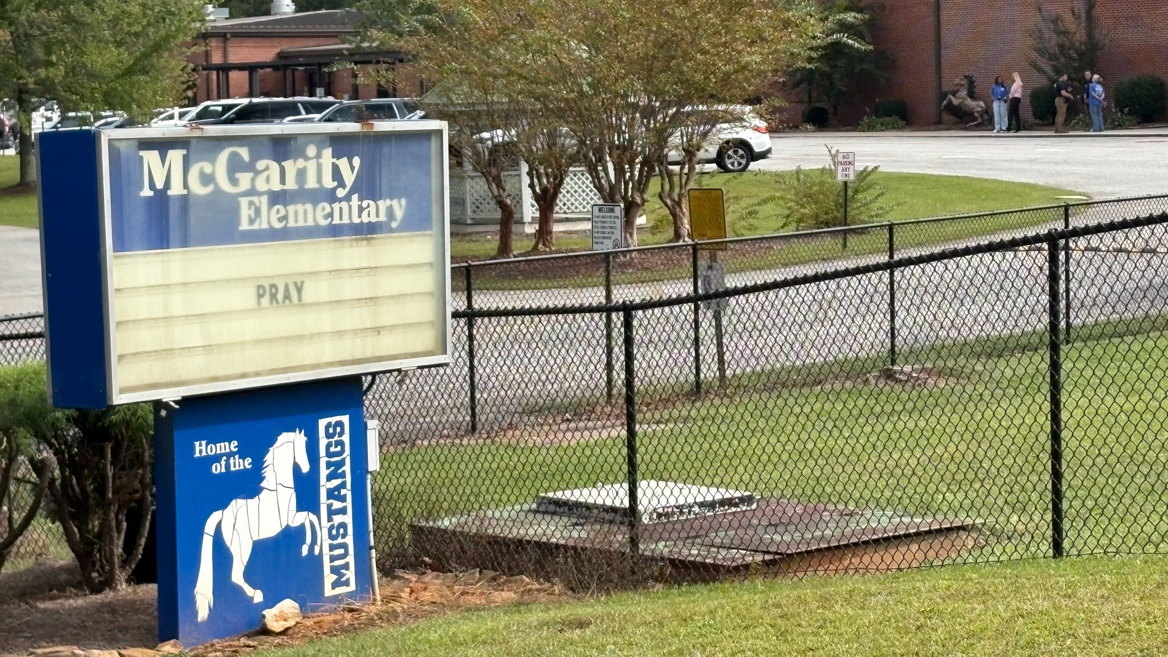 A McGarity Elementary School student, 6, was found unresponsive in a pool near a residence at Carlton Farms in Polk County, officials said. Outside the school, the marquee sign read, "Pray." (Alexis Stevens/AJC)