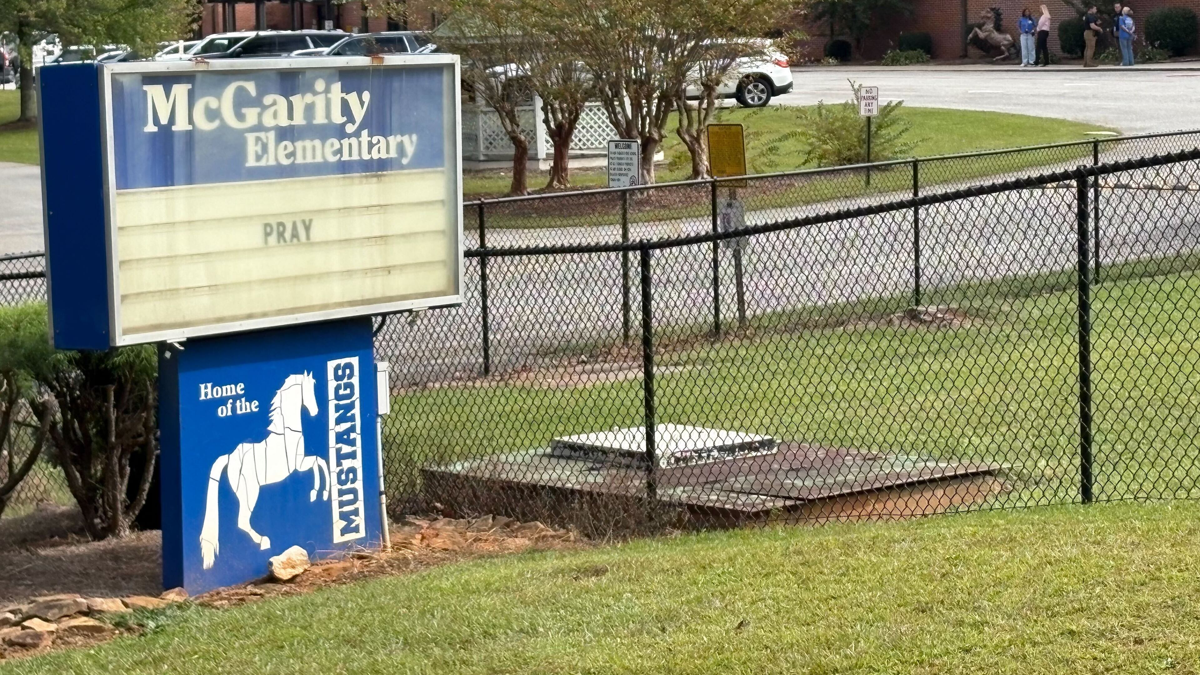 Outside of McGarity Elementary School, the marquee sign simply reads "Pray." A student, 6, was found unresponsive in a pool near a residence at Carlton Farms in Polk County. She was taken to a hospital where she died. (Alexis Stevens/AJC)