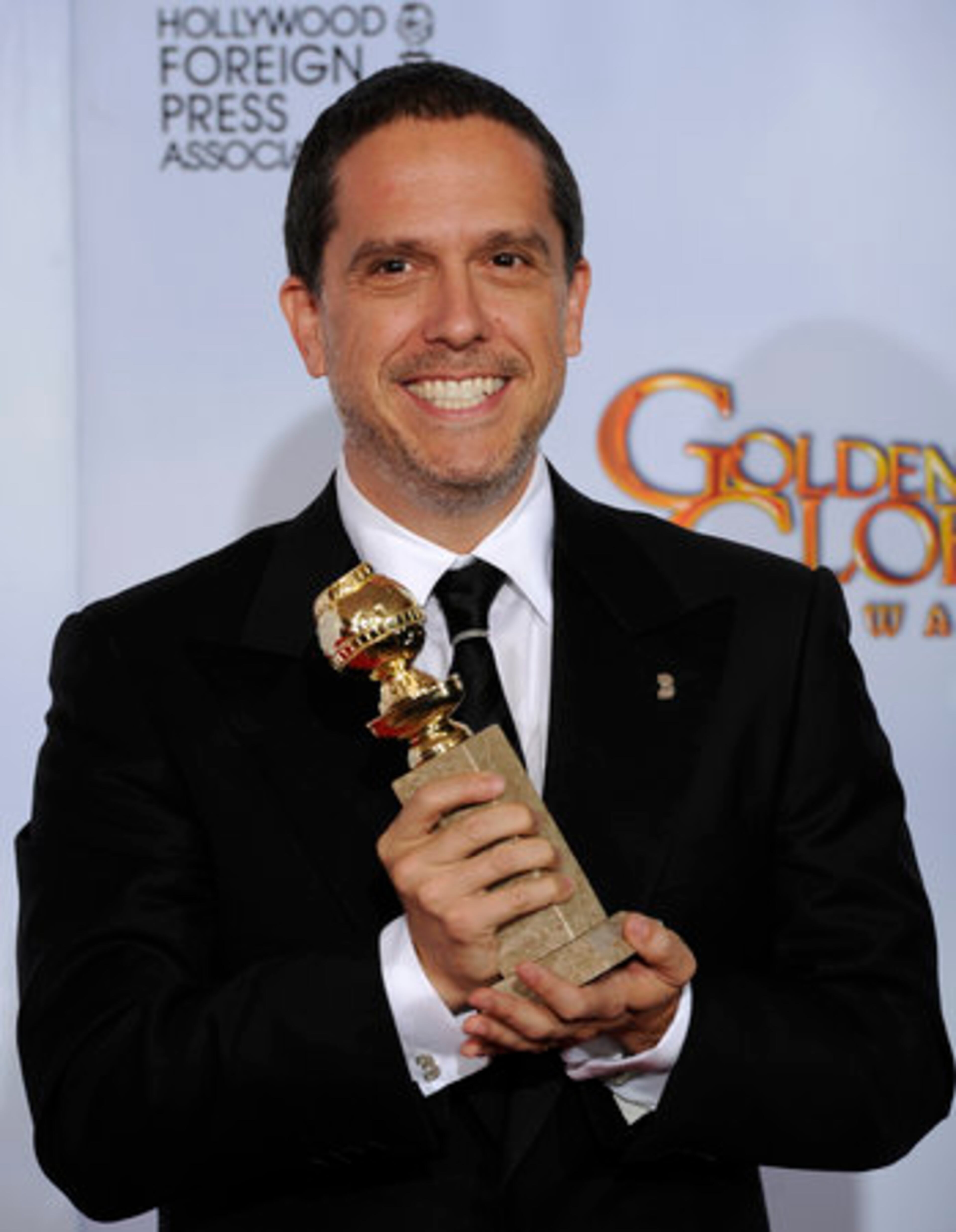 Director Lee Unkrich poses with the trophy he won for Best Animated Feature Film for his film "Toy Story 3," at the Golden Globe Awards Sunday, Jan. 16, 2011, in Beverly Hills, Calif.