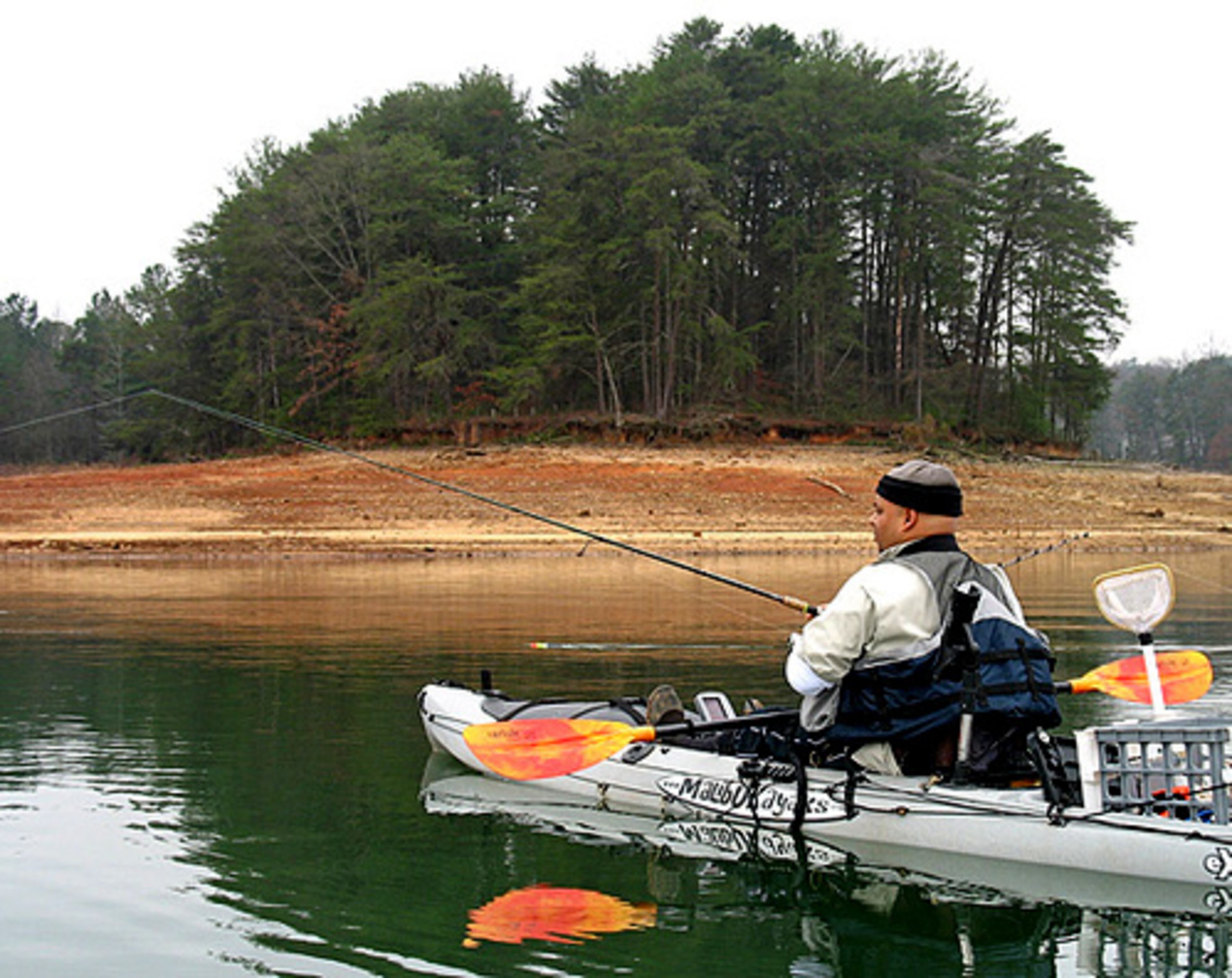Tony Narcisse fishes next to a newly exposed shoreline on Lanier. His club, started less than 2 years ago, now has 360 members statewide, and there are plans for a fishing tournament in 2008.
