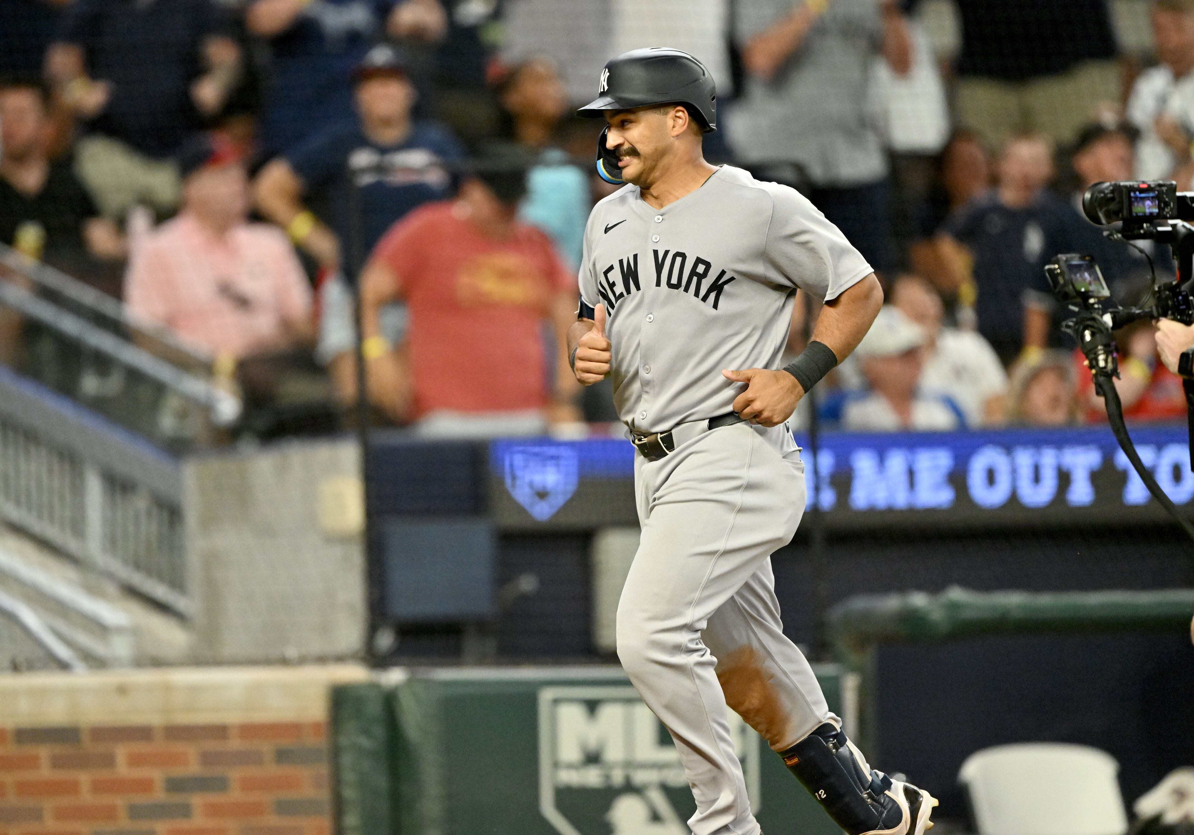 New York Yankees outfielder Trent Grisham (12) reacts as he circles the bases on a grand slam during the ninth inning of a baseball game at Truist Park, Saturday, July 19, 2025, in Atlanta. New York Yankees won 12-9 over Atlanta Braves. (Hyosub Shin / AJC)