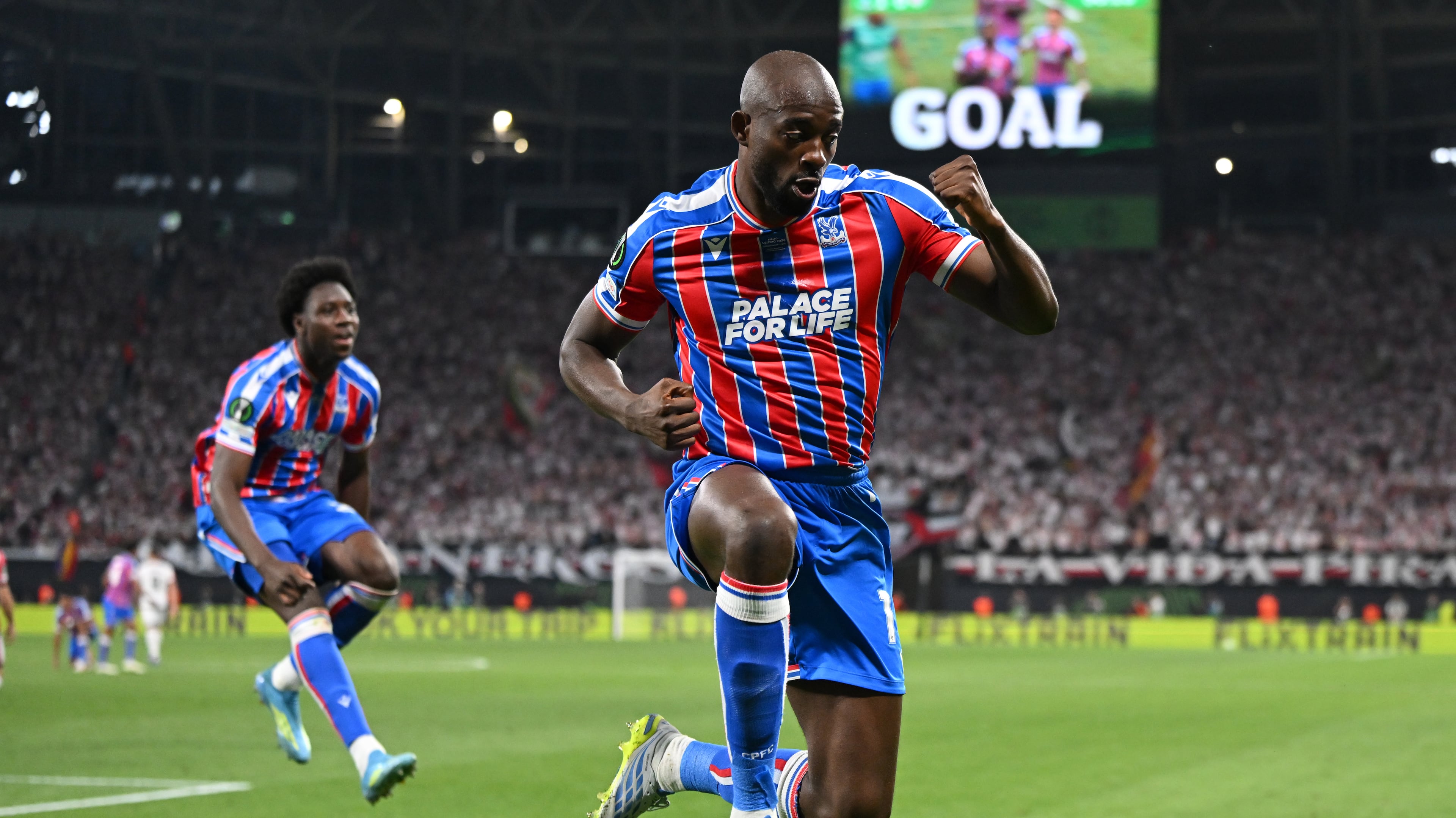 Crystal Palace's Jean-Philippe Mateta celebrates after scoring during the Europa Conference League final soccer match between Crystal Palace and Rayo Vallecano in Leipzig, Germany, Wednesday, May 27, 2026. (Robert Michael/dpa via AP)