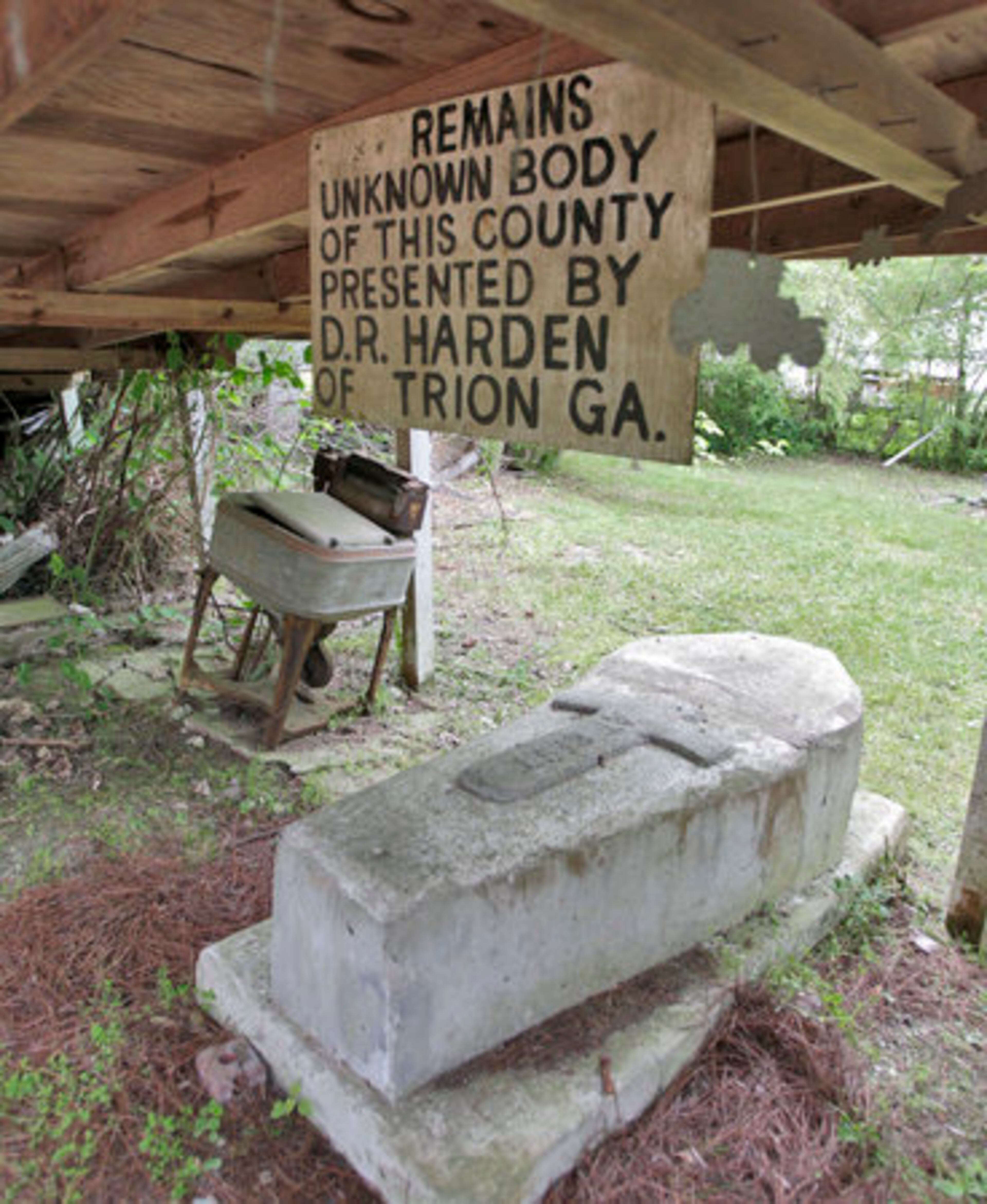 The garden contains a body, which is believed to be real.