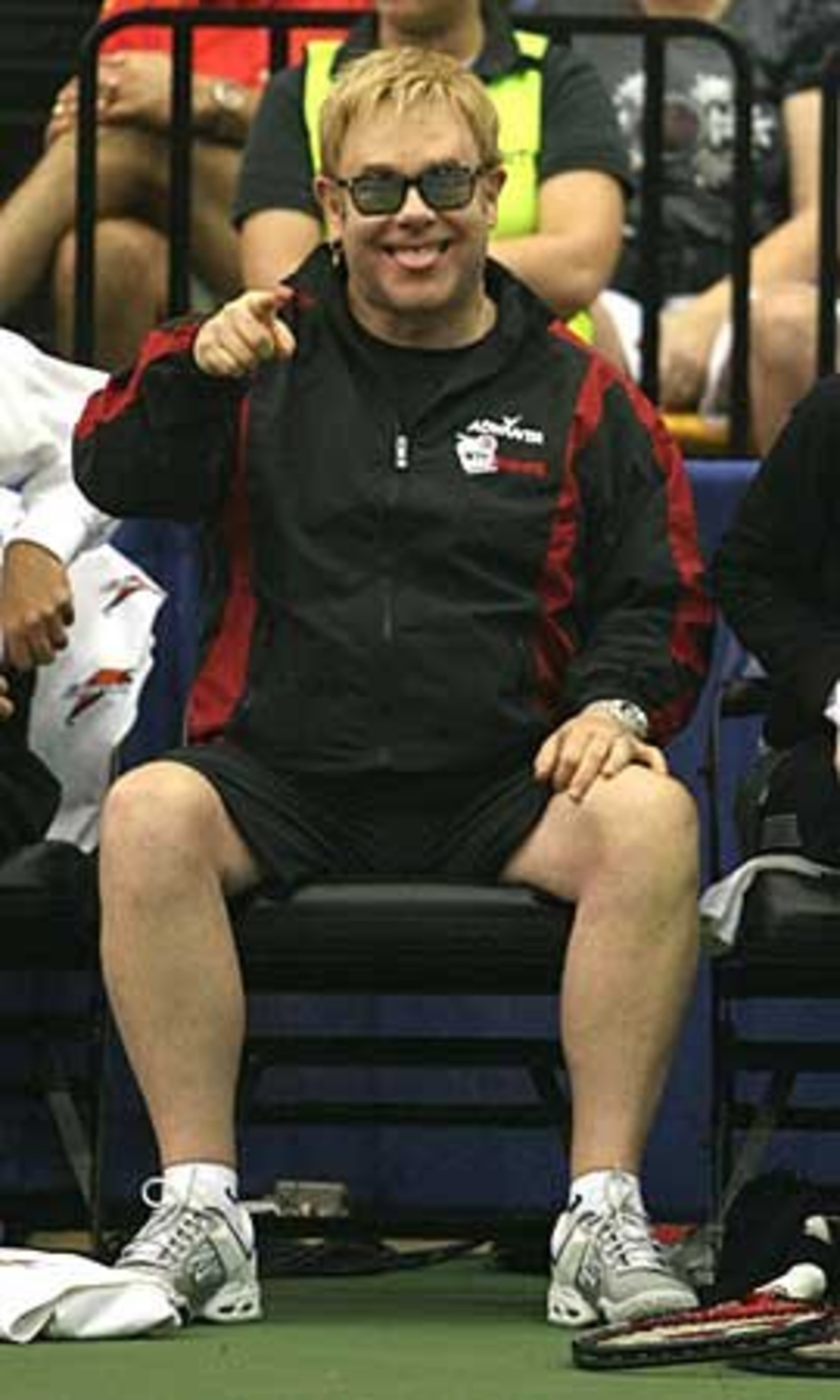 Elton John jokes with audience members during the Advanta WTT Smash Hits tennis event at Kennesaw State University.