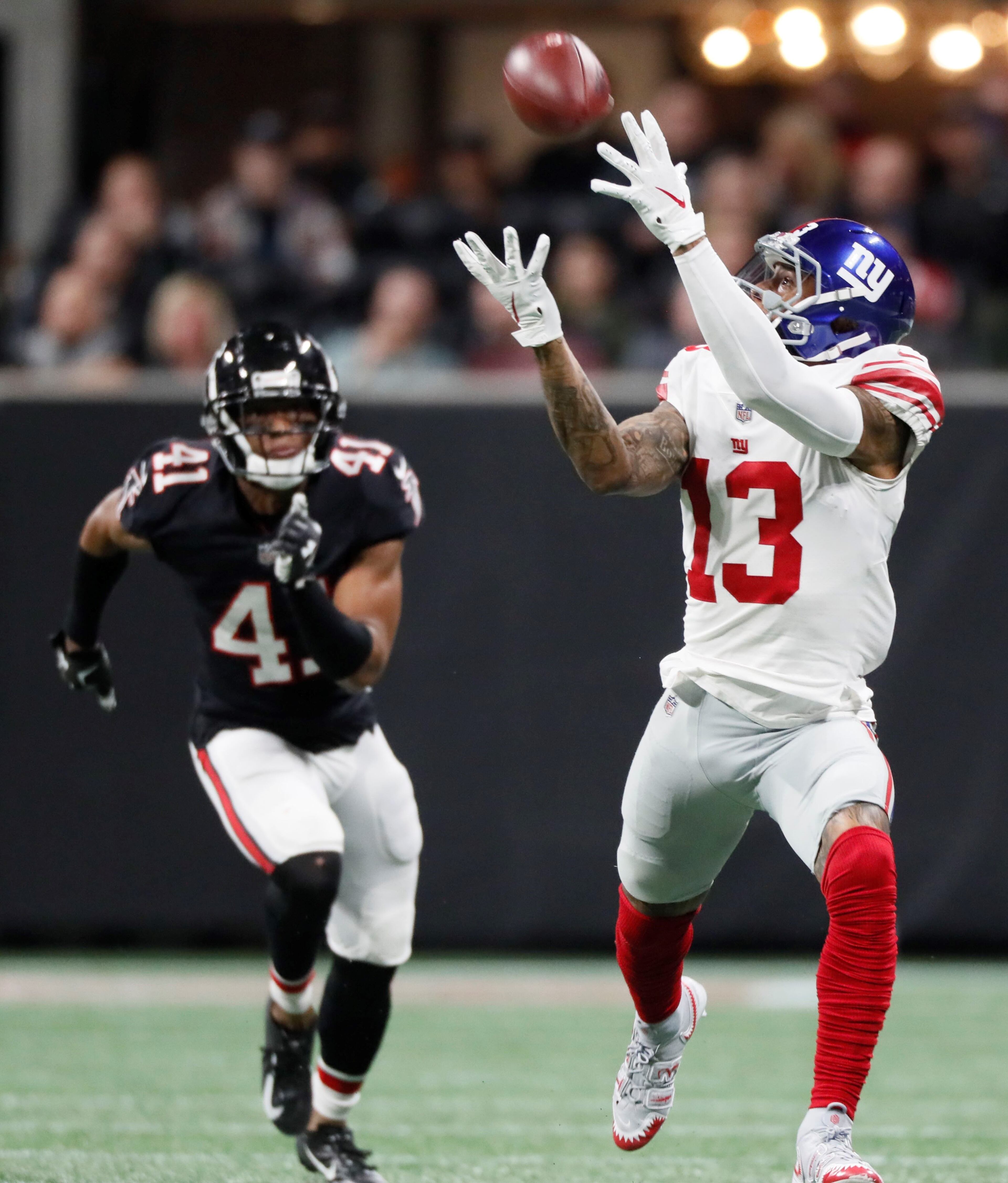 10/22/18 - Atlanta - Atlanta Falcons defensive back Sharrod Neasman (41) can't keep up with a wide open New York Giants wide receiver Odell Beckham (13) on this long pass from New York Giants quarterback Eli Manning (10) that set up a Giants score. The Atlanta Falcons played the New York Giants in an NFL football game Monday, October 22, 2018, at Mercedes-Benz Stadium in Atlanta, GA. BOB ANDRES / BANDRES@AJC.COM