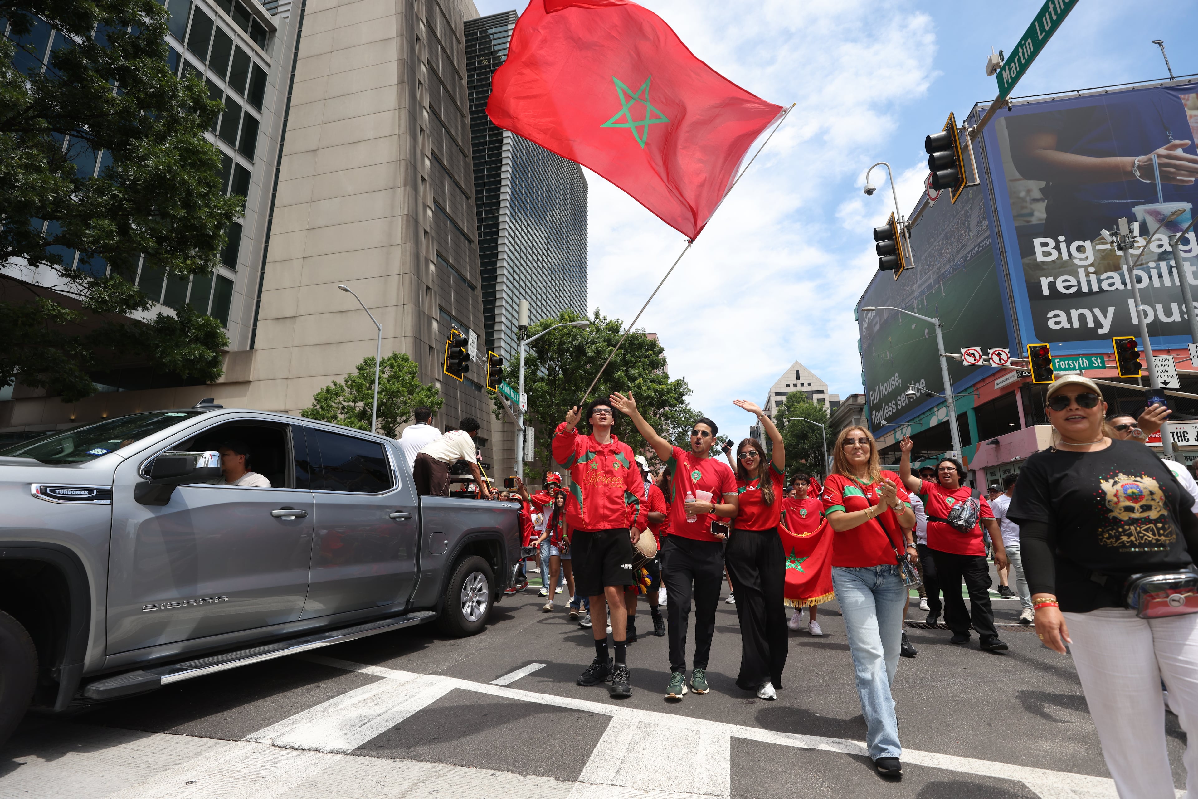 Fans of Morocco march from Founders Green on Broad Street to Atlanta Stadium (Mercedes-Benz Stadium) before the start of the Morocco vs. Haiti Group C match on Wednesday, June 24, 2026. (Jason Getz/AJC)