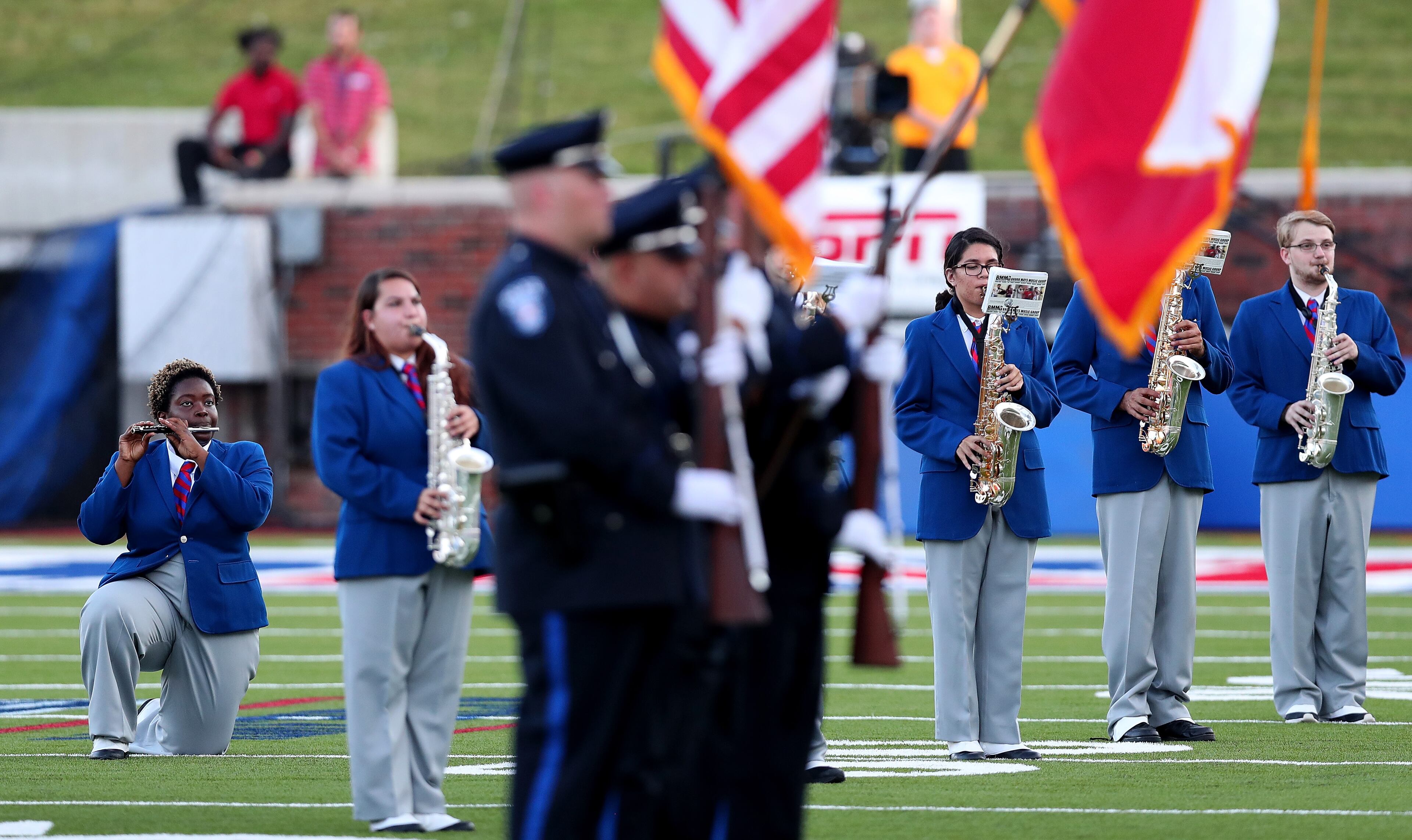 DALLAS, TX - SEPTEMBER 23: A member of the against the Southern Methodist Mustangs marching band kneels during the playing of the national anthem before the Southern Methodist Mustangs take on the TCU Horned Frogs at Gerald J. Ford Stadium on September 23, 2016 in Dallas, Texas. (Photo by Tom Pennington/Getty Images)