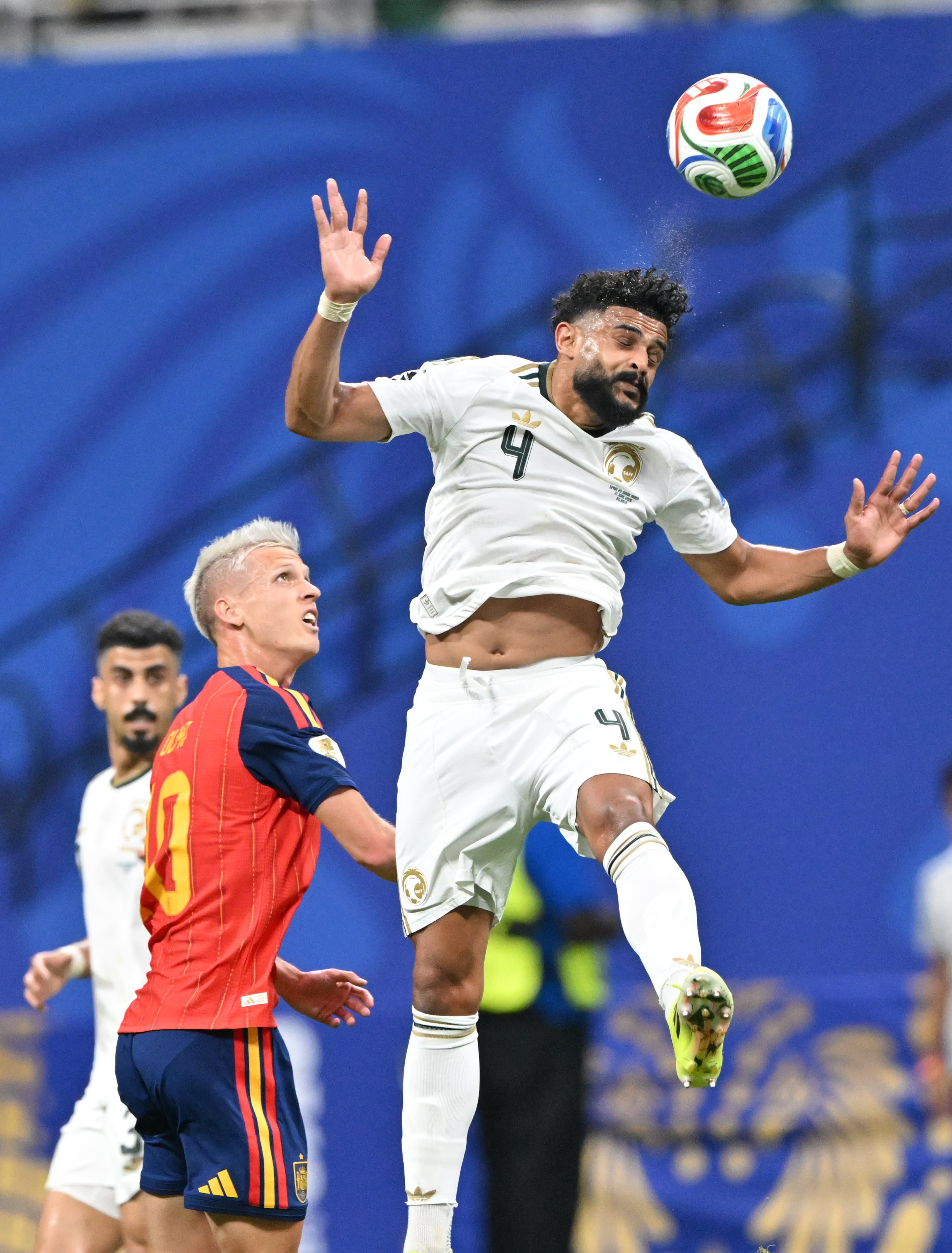 Saudi Arabia's Abdulelah Al-Amri (right) heads the ball away from Spain's Dani Olmo during the first half of the Spain vs. Saudi Arabia World Cup match Sunday, June 21, 2026, at Atlanta Stadium. (Hyosub Shin/AJC)