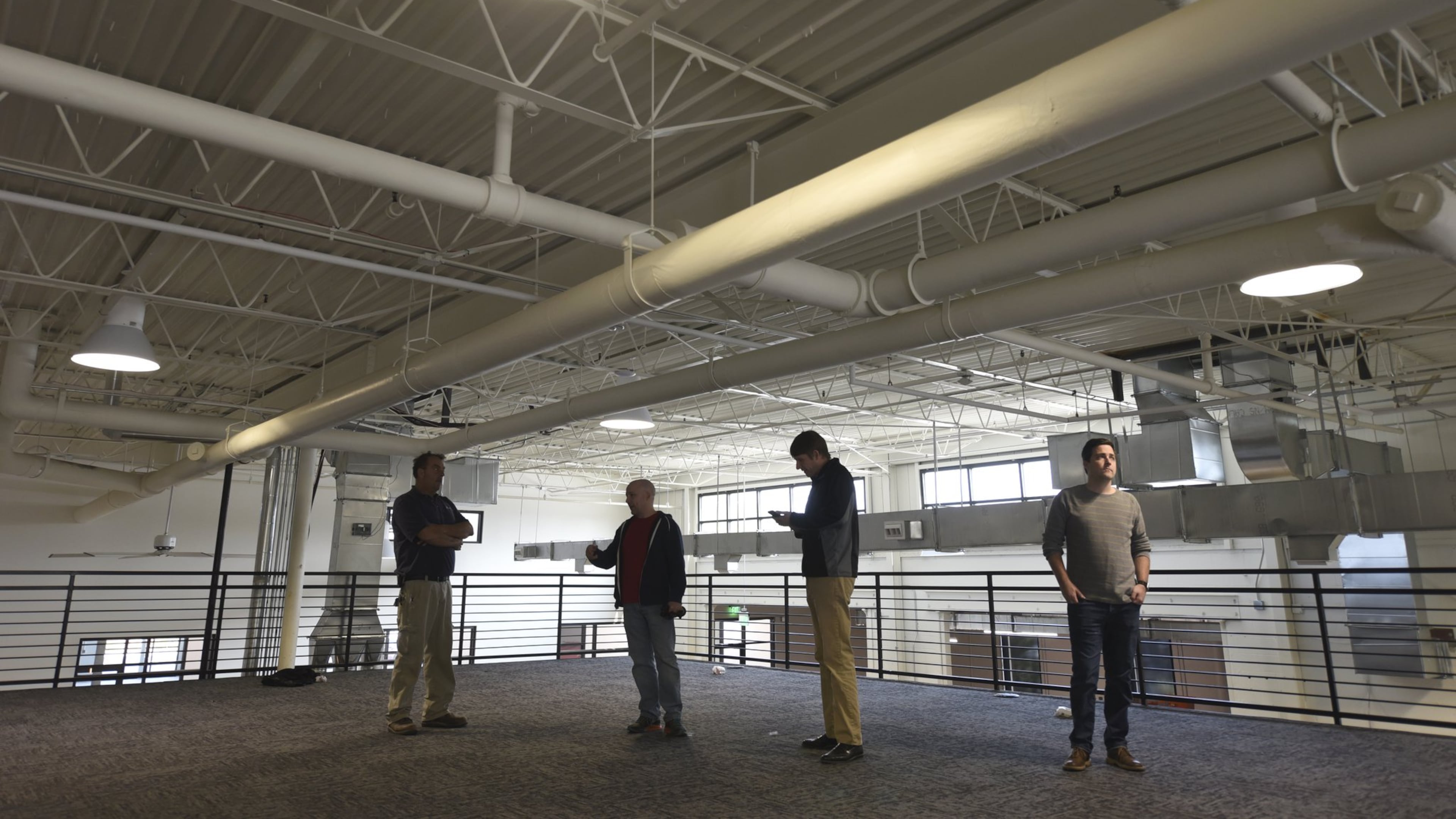 November 14, 2016, Atlanta - From left, David Tafelski, Scott McManus, Jim Boatright and Josh Teague, stand in the future office space of tech company FullStory in Atlanta, on Monday, November 14, 2016. (DAVID BARNES / DAVID.BARNES@AJC.COM)