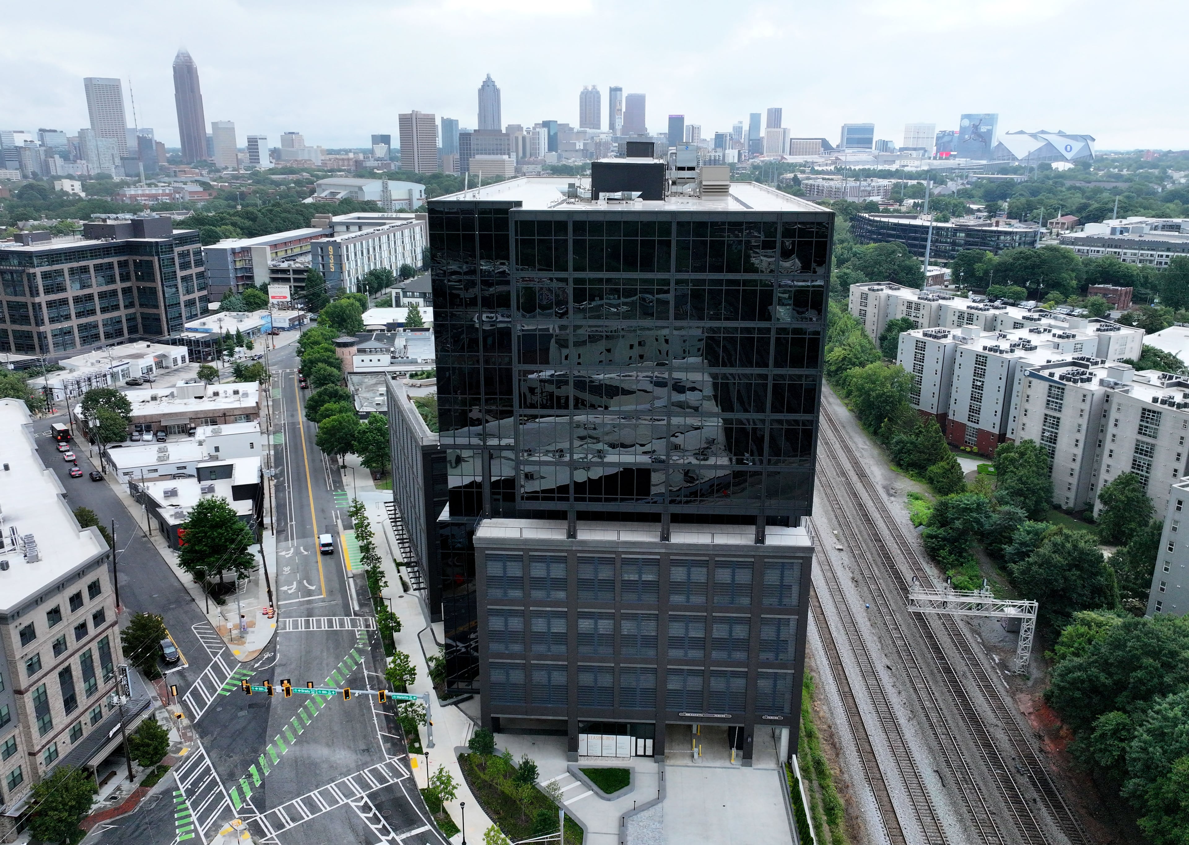 The Atlanta skyline is seen behind the 1050 Brickworks building on Tuesday, July 14, 2026. (Hyosub Shin/AJC)
