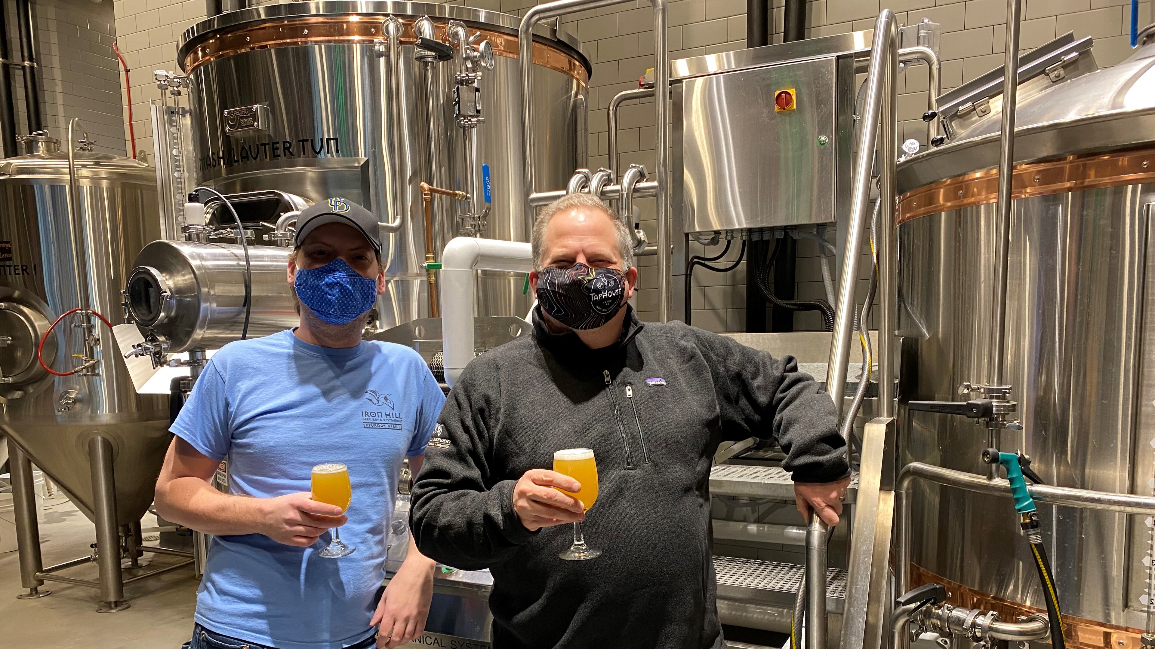 Director of Brewing Operations Mark Edelson (right) and head brewer Alex Vanderlek are at Iron Hill Brewery & Restaurant in Buckhead. Bob Townsend for The AJC