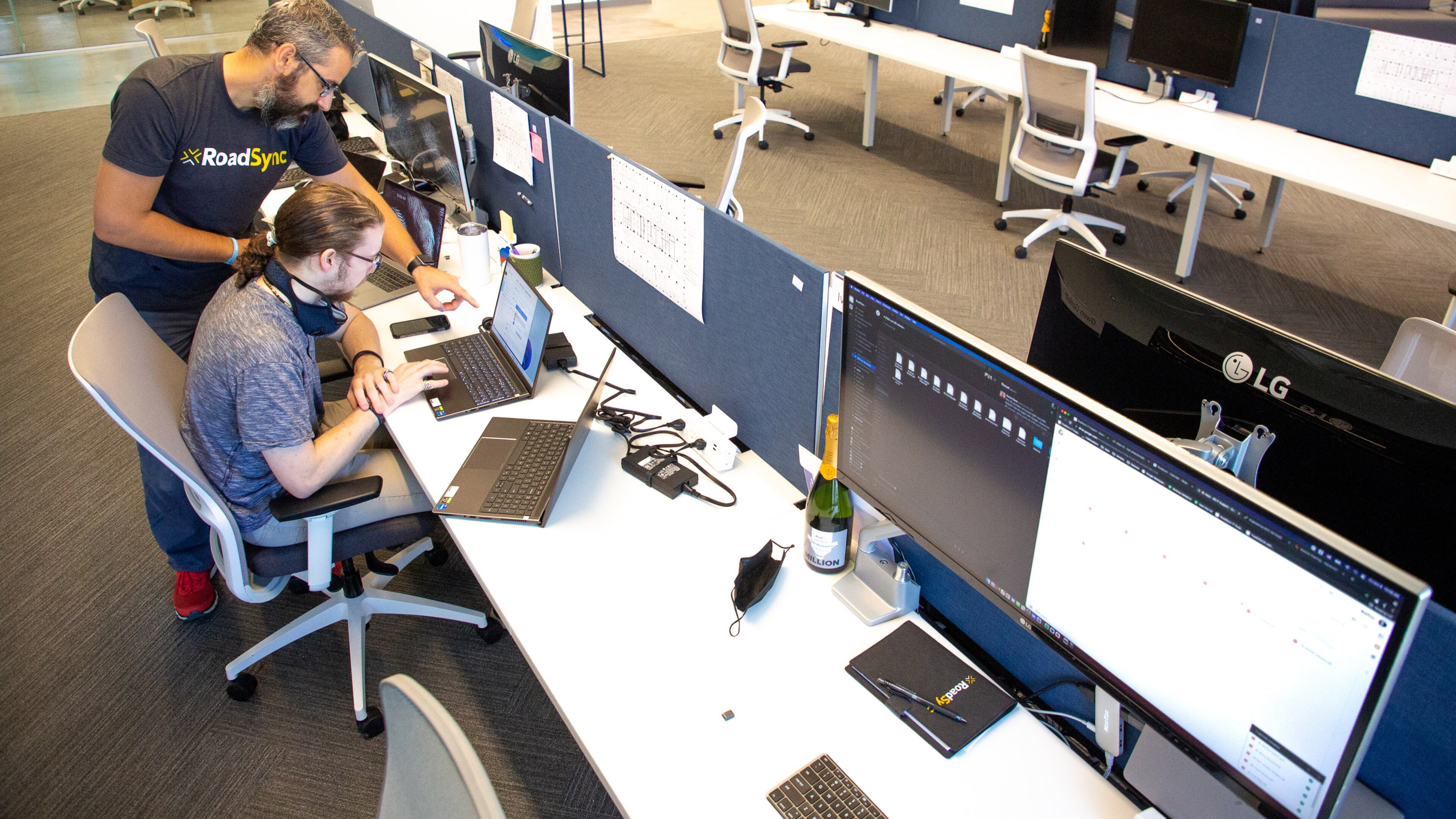 RoadSync employees Ivan Zhelezarov (L) and Alex Petralia work in the company's new office space in Atlanta. RoadSync and other companies are beginning to commit to having employees return to work by signing new office leases. STEVE SCHAEFER FOR THE ATLANTA JOURNAL-CONSTITUTION