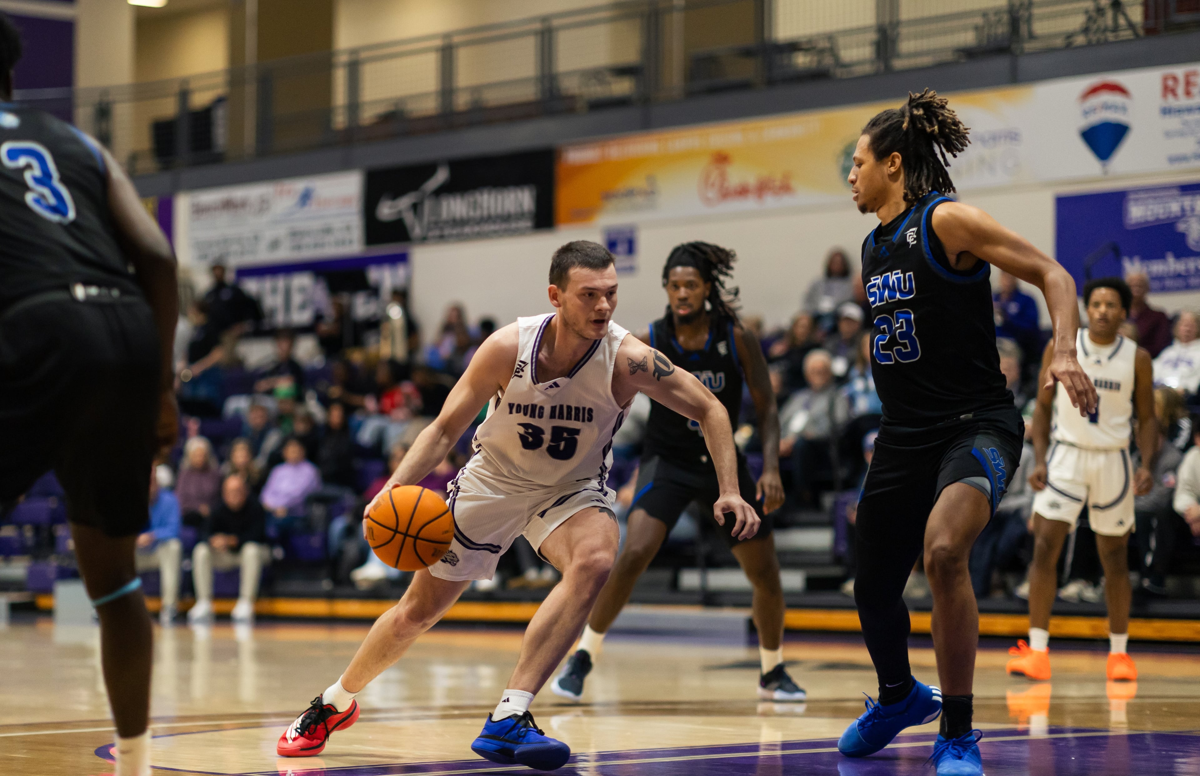 Young Harris standout Carl Cleveland (center) missed the 2023-24 season because of a broken foot that required a screw to be inserted. The senior says it was the toughest time of his life. “That kind of pushed me these last two years.” (Courtesy of Curtis Markham)