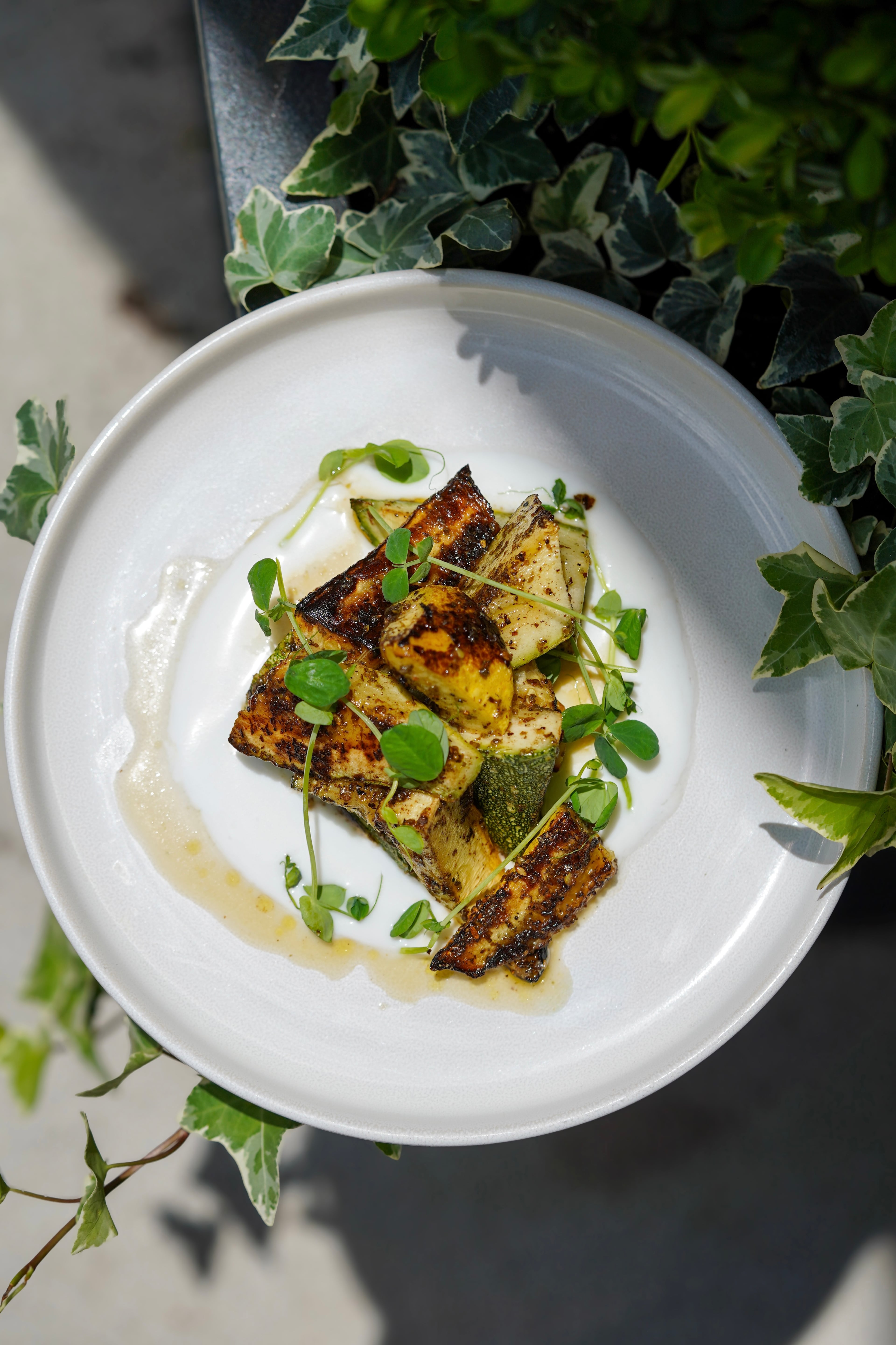 Chef Demetrius Brown brings a northern African touch to summer squash at Bread & Butterfly in the Inman Quarter development. (Courtesy of Cam McMinn)