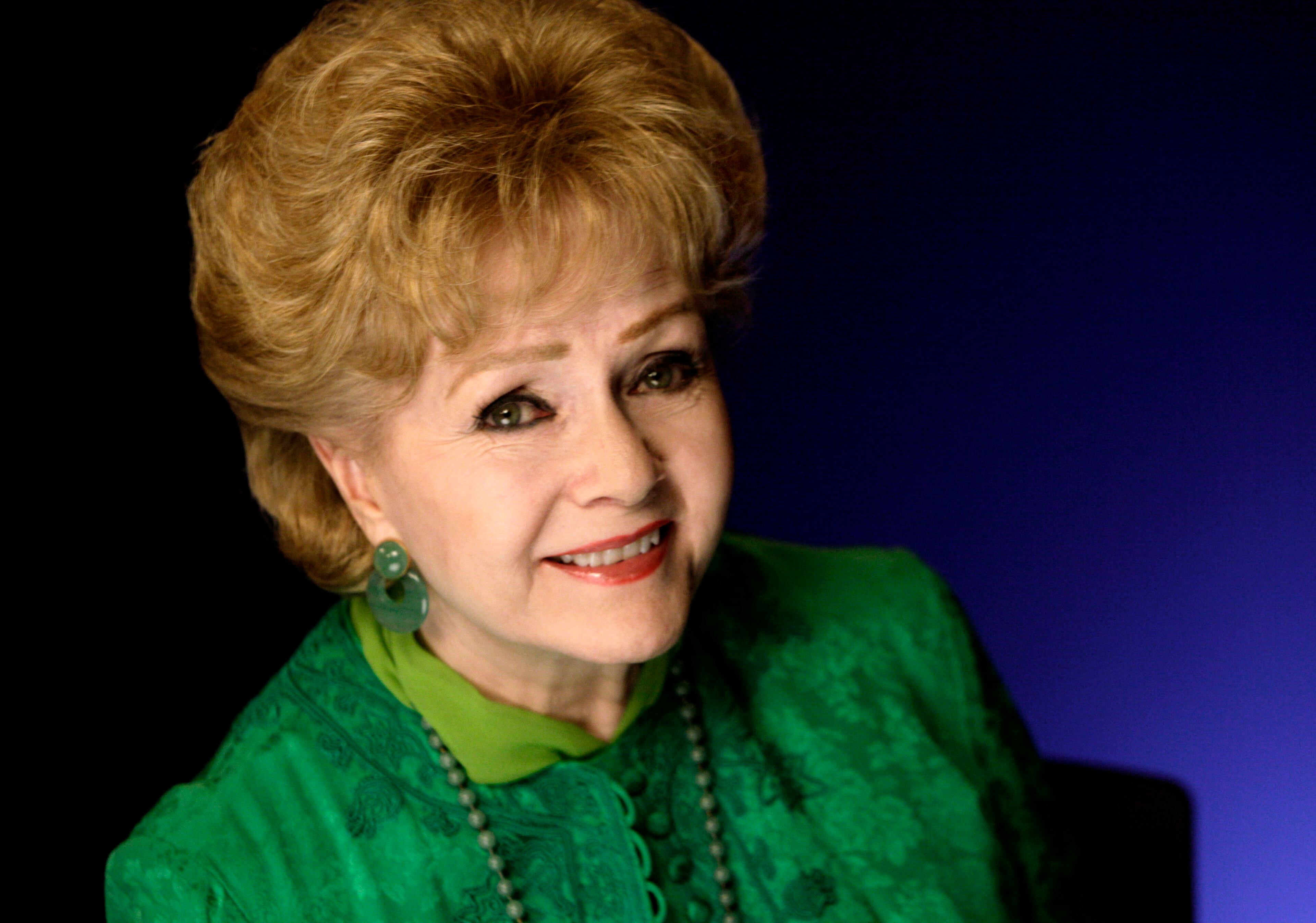 This Oct. 14, 2011, file photo shows actress Debbie Reynolds posing for a portrait in New York. (AP Photo/Richard Drew, File)