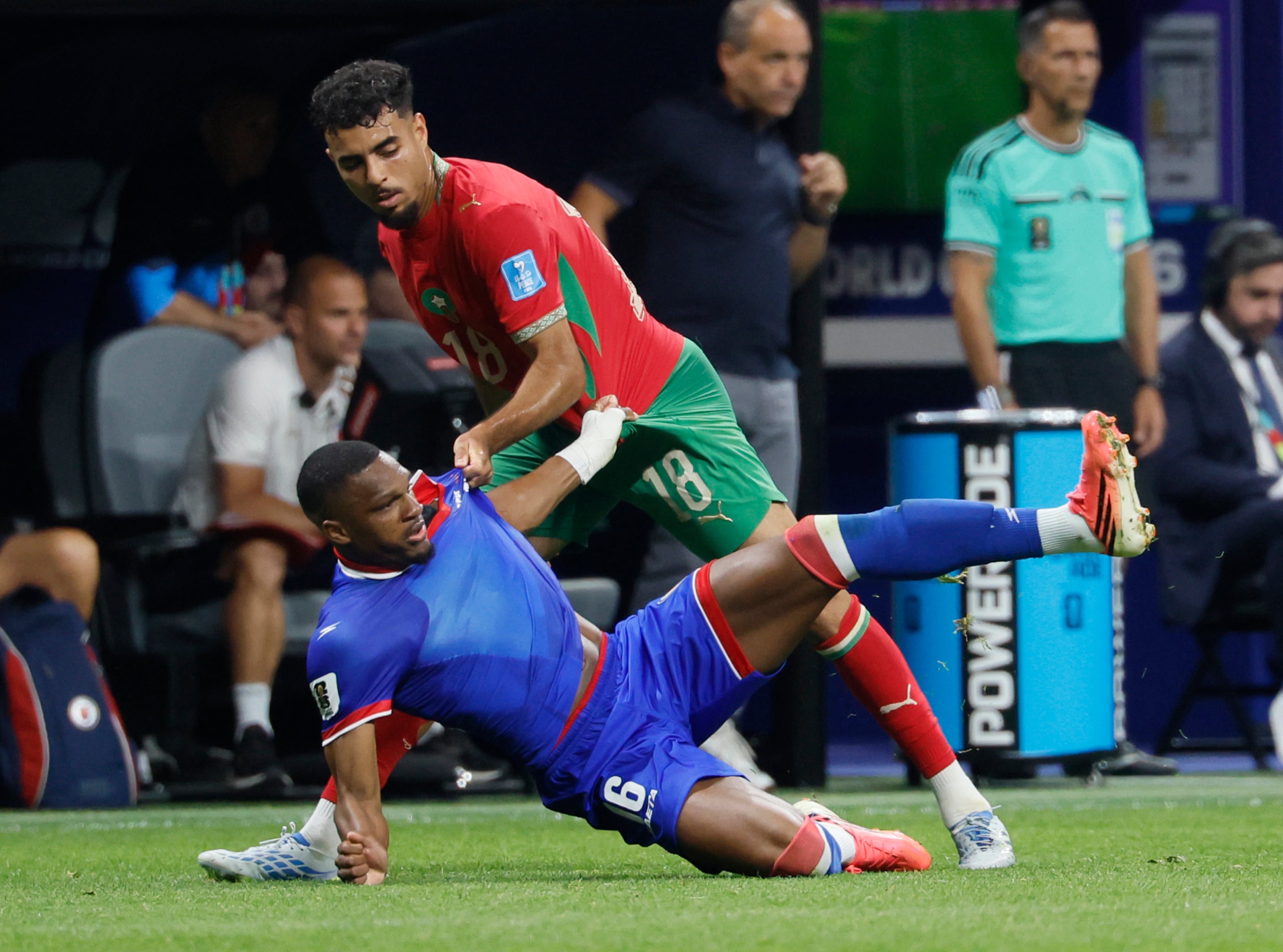 Morocco's Chadi Riad, right, grabs the jersey of Haiti's Lenny Joseph during second half of Morocco vs. Haiti Group C FIFA World Cup match at Atlanta Stadium (Mercedes-Benz Stadium) on Wednesday, June 24, 2026. (Miguel Martinez/AJC)