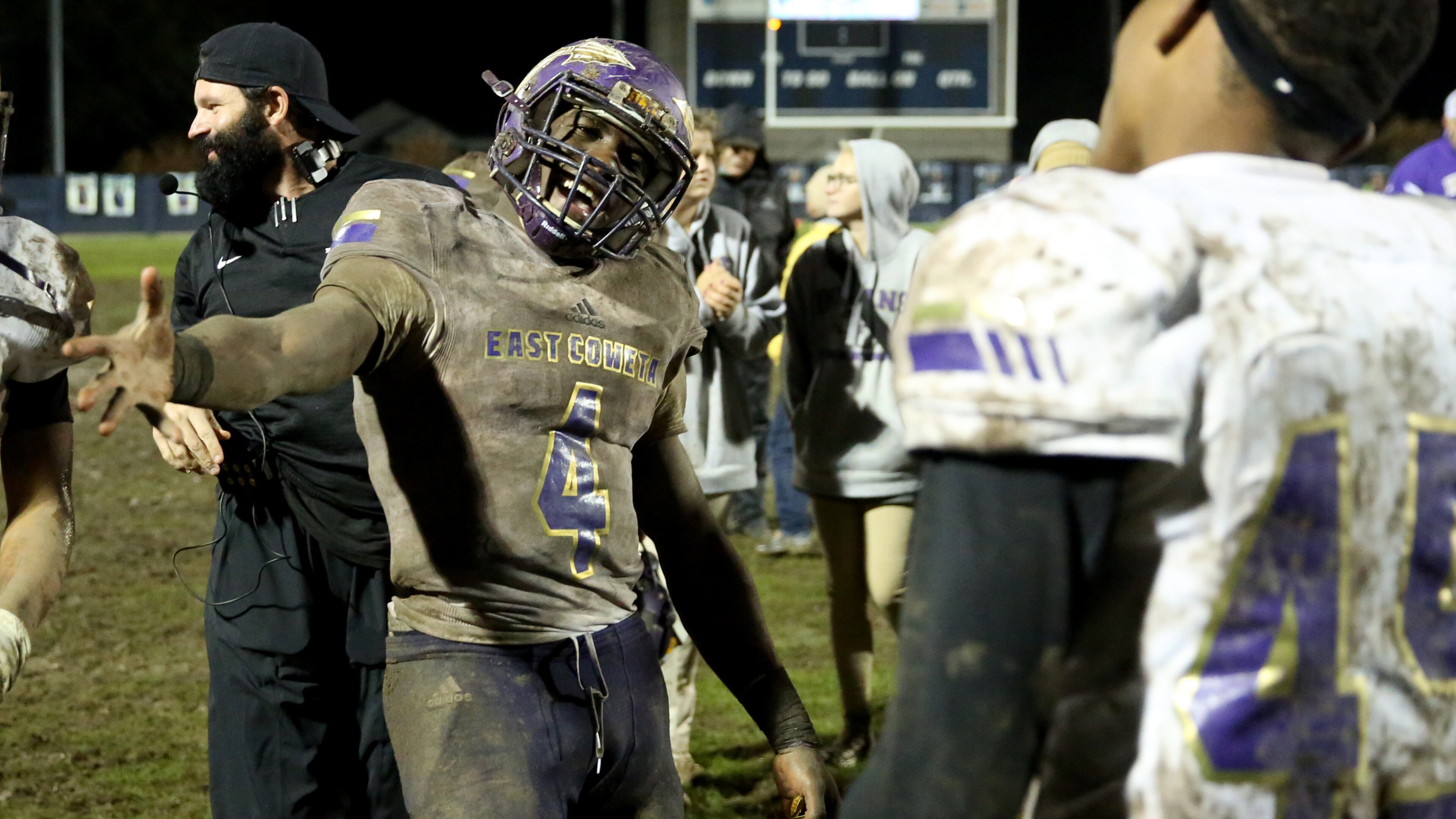 East Coweta running back Gerald Green celebrates with teammates after their 28-26 win against Marietta Friday in the first round of the Class AAAAAAA playoffs. (Jason Getz/Special)