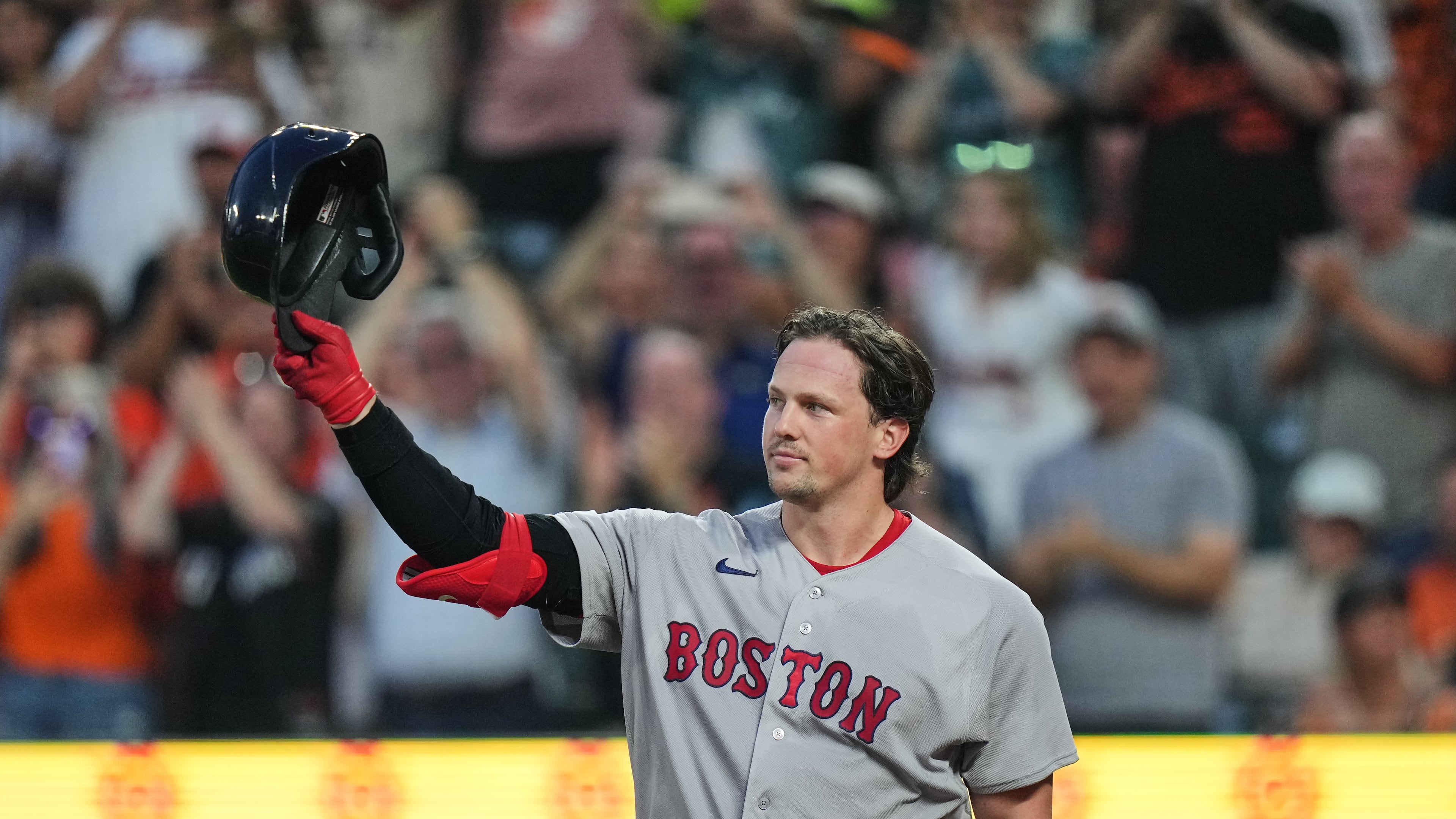 Boston Red Sox catcher Adley Rutschman acknowledges the crowd as he is honored during the first inning of a baseball game against the Baltimore Orioles, Thursday, Sept. 3, 2026, in Baltimore. (AP Photo/Stephanie Scarbrough)