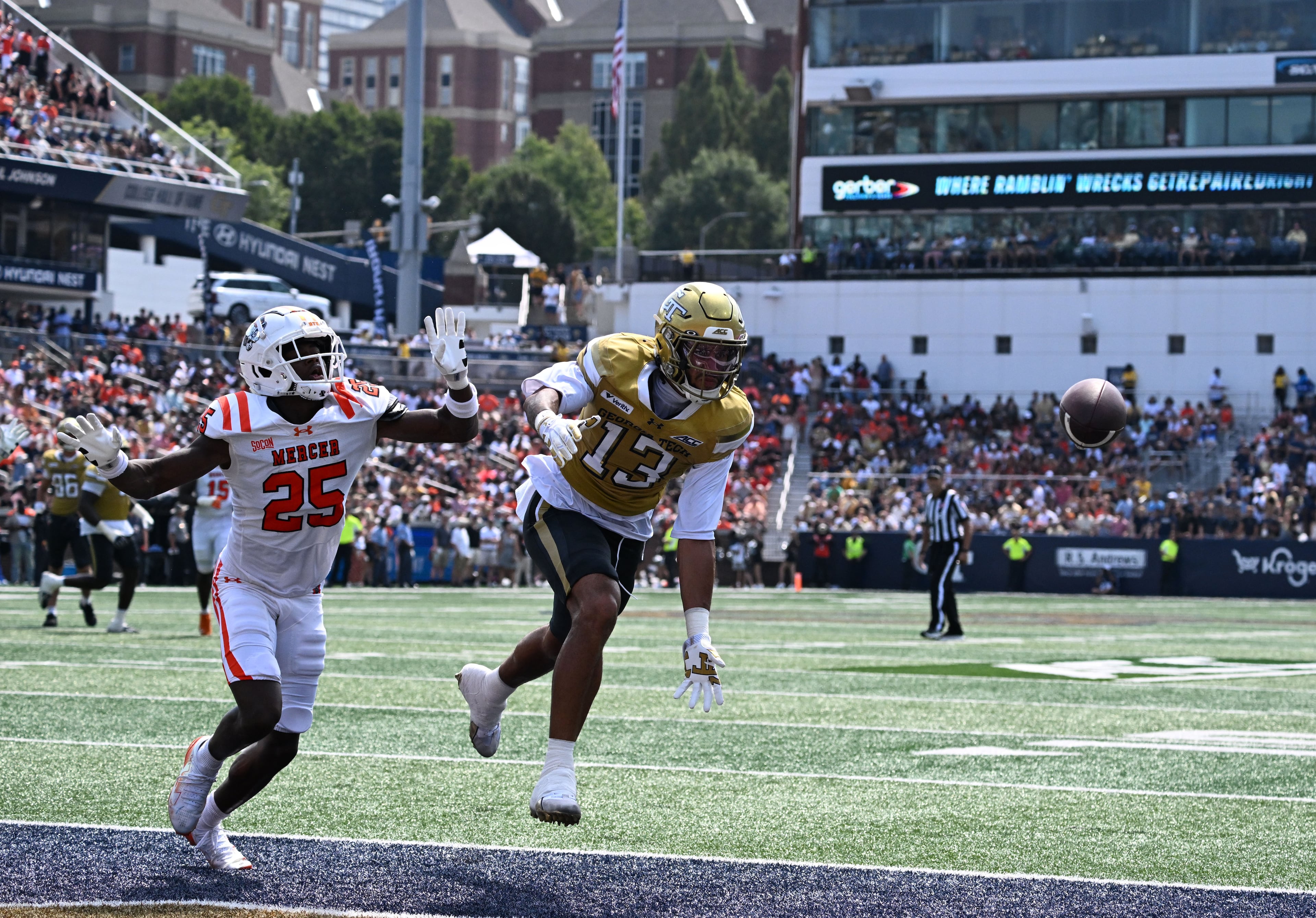 Georgia Tech wide receiver Isaiah Fuhrmann (13) is not able to catch under pressure from Mercer linebacker Evin McDowell (25) during the first half in an NCAA college football game at Bobby Dodd Stadium on Saturday, Sept. 19, 2026, in Atlanta. (Hyosub Shin/AJC)
