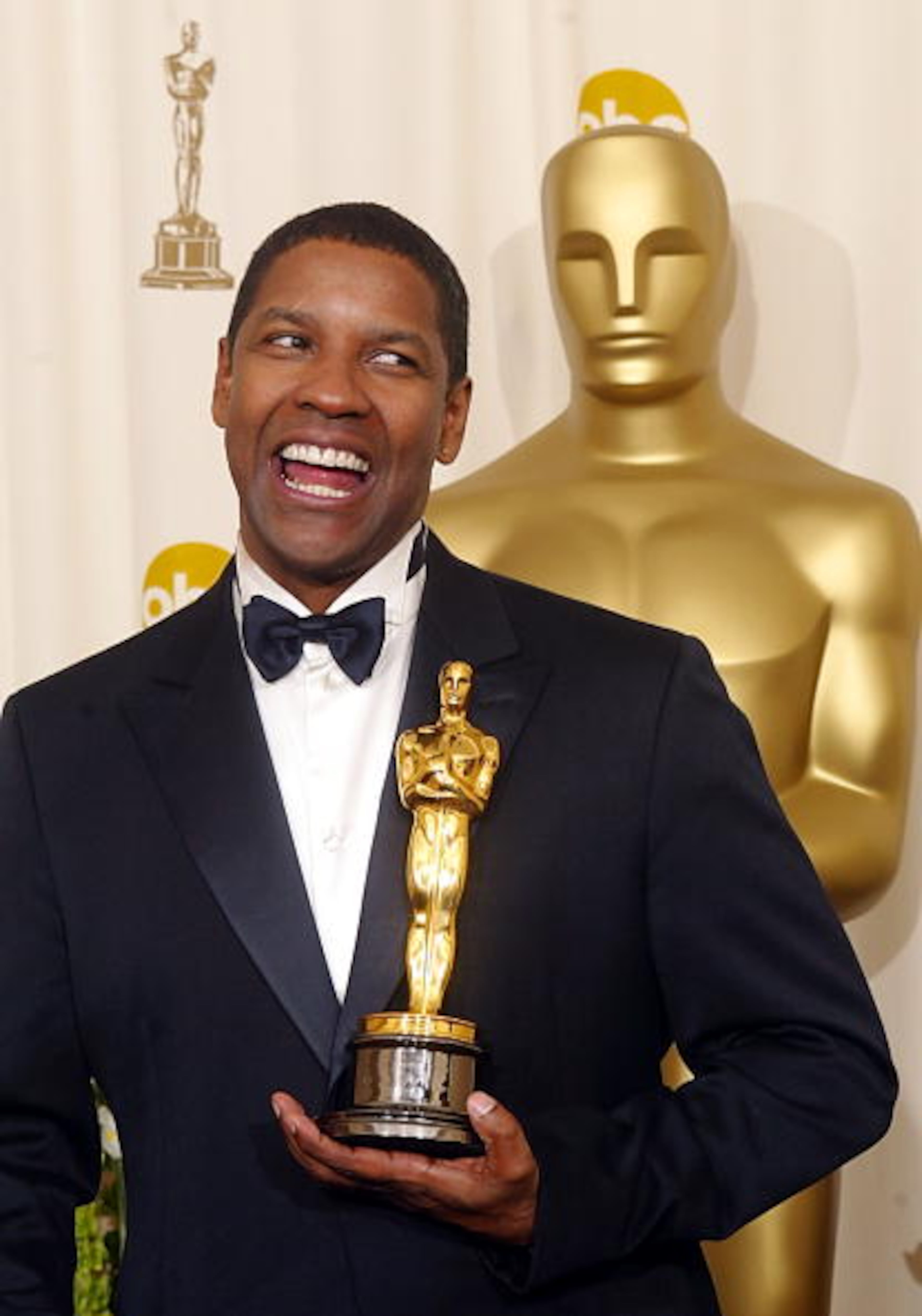 HOLLYWOOD, UNITED STATES: US actor Denzel Washington holds his Oscar after winning the award for best actor in a leading role for his portrayal of Alonzo, a narcotics officer who has crossed the dangerous line between cop and criminal, in the movie "Training Day" 24 March, 2002 at the 74th Academy Awards at the Kodak Theatre in Hollywood, CA. AFP PHOTO/Mike NELSON (Photo credit should read MIKE NELSON/AFP/Getty Images)
