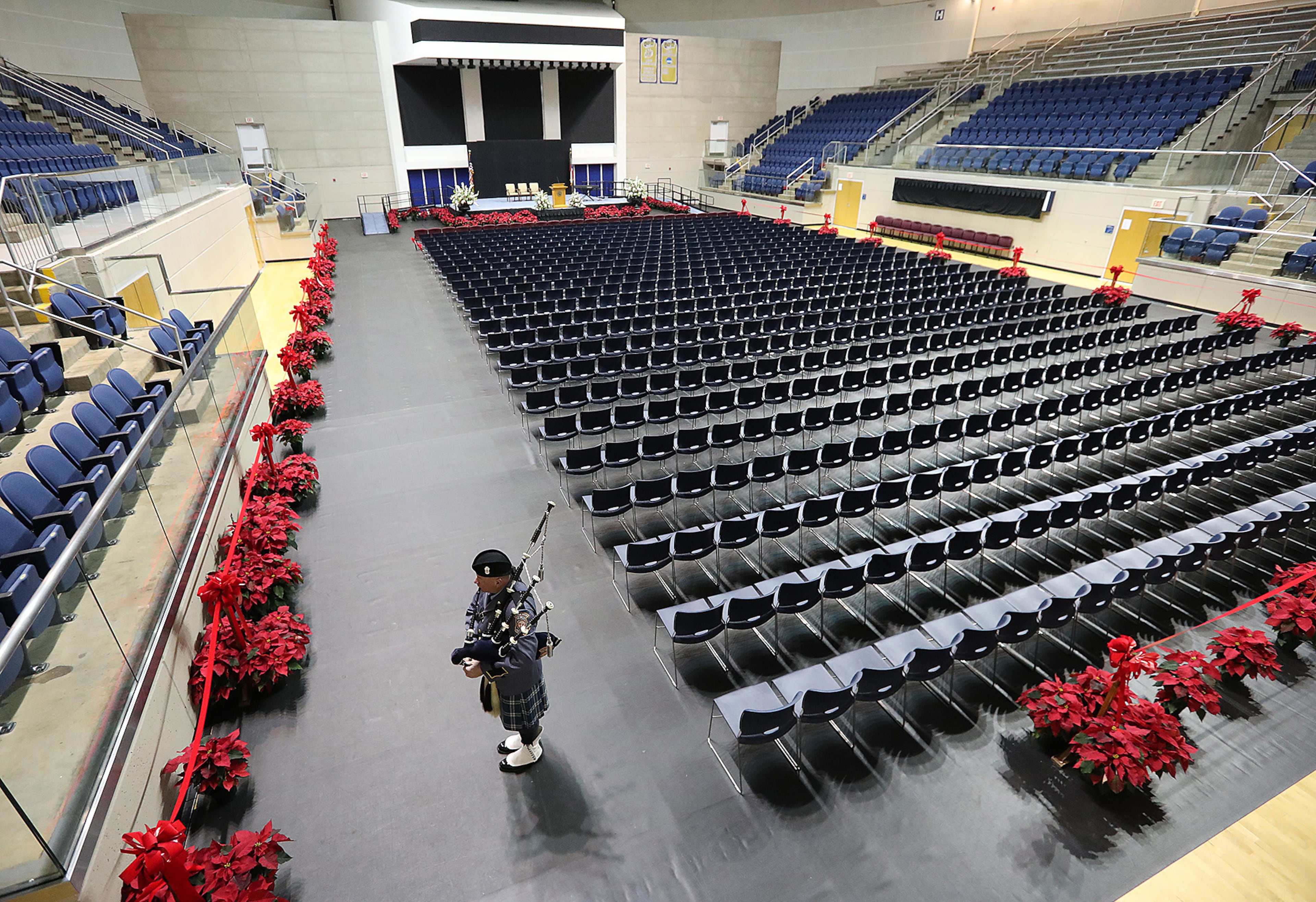 December 11, 2016, AMERICAS: A solitary honor guard bagpiper breaks the silence playing for Americus police officer Nicholas Ryan Smarr during his arrival by honor guard to his funeral service that will be held later in the day at the Georgia Southwestern State University Storm Dome on Sunday, Dec. 11, 2016, in Americas. Officer Smarr and Georgia Southwestern State University campus police officer Jody Smith were killed responding to a domestic dispute. Curtis Compton/ccompton@ajc.com