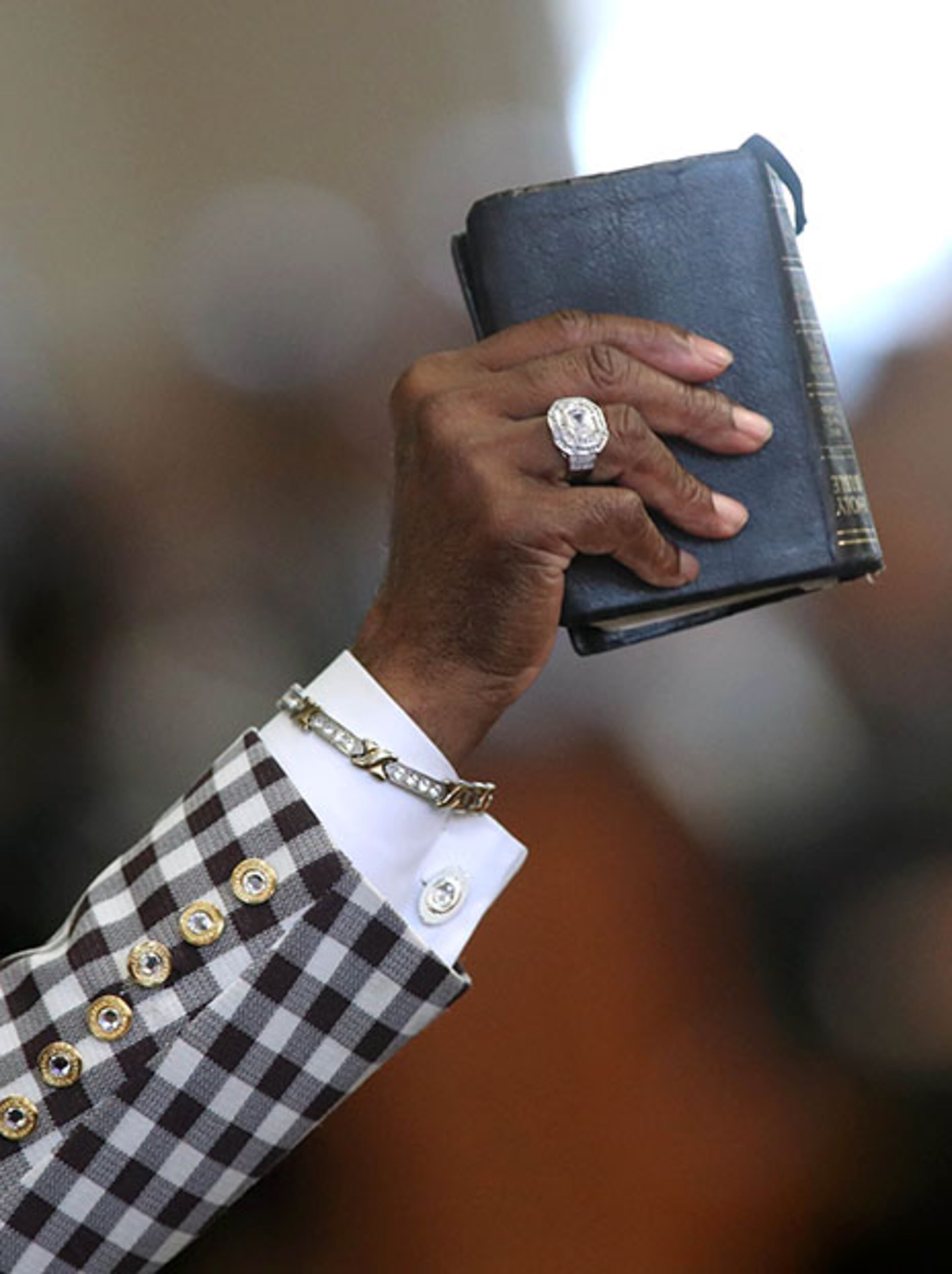 January 16, 2017 - Atlanta, Ga: Cal Murrell holds a bible as he reacts to a speech during the 49th annual Martin Luther King Jr. Commemorative Service at Ebenezer Baptist Church Monday, January 16, 2017, in Atlanta, Ga. PHOTO / JASON GETZ