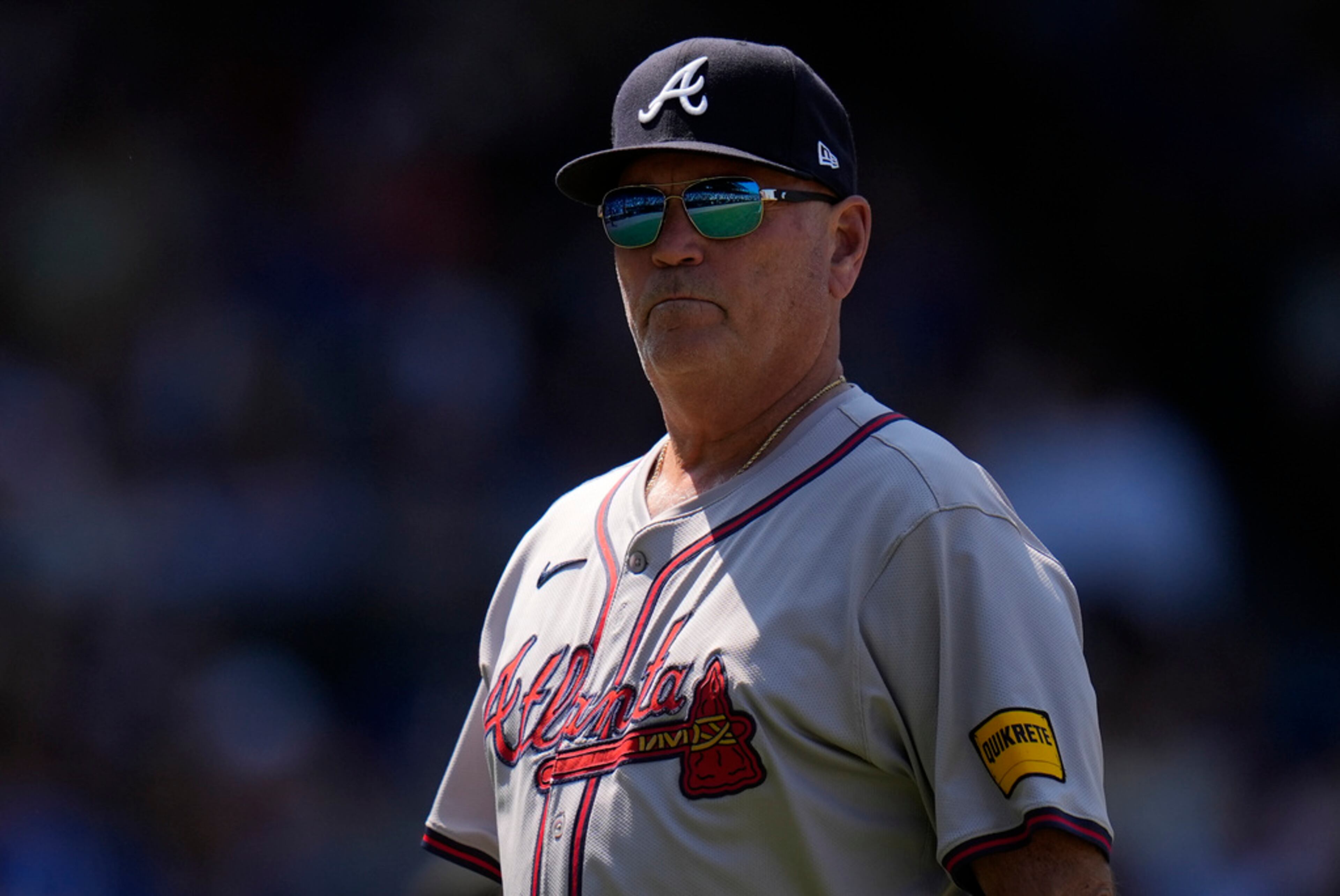 Atlanta Braves manager Brian Snitker returns to the dugout after making a pitching change during the fifth inning of a baseball game against the Chicago Cubs, Thursday, May 23, 2024, in Chicago. (AP Photo/Erin Hooley)